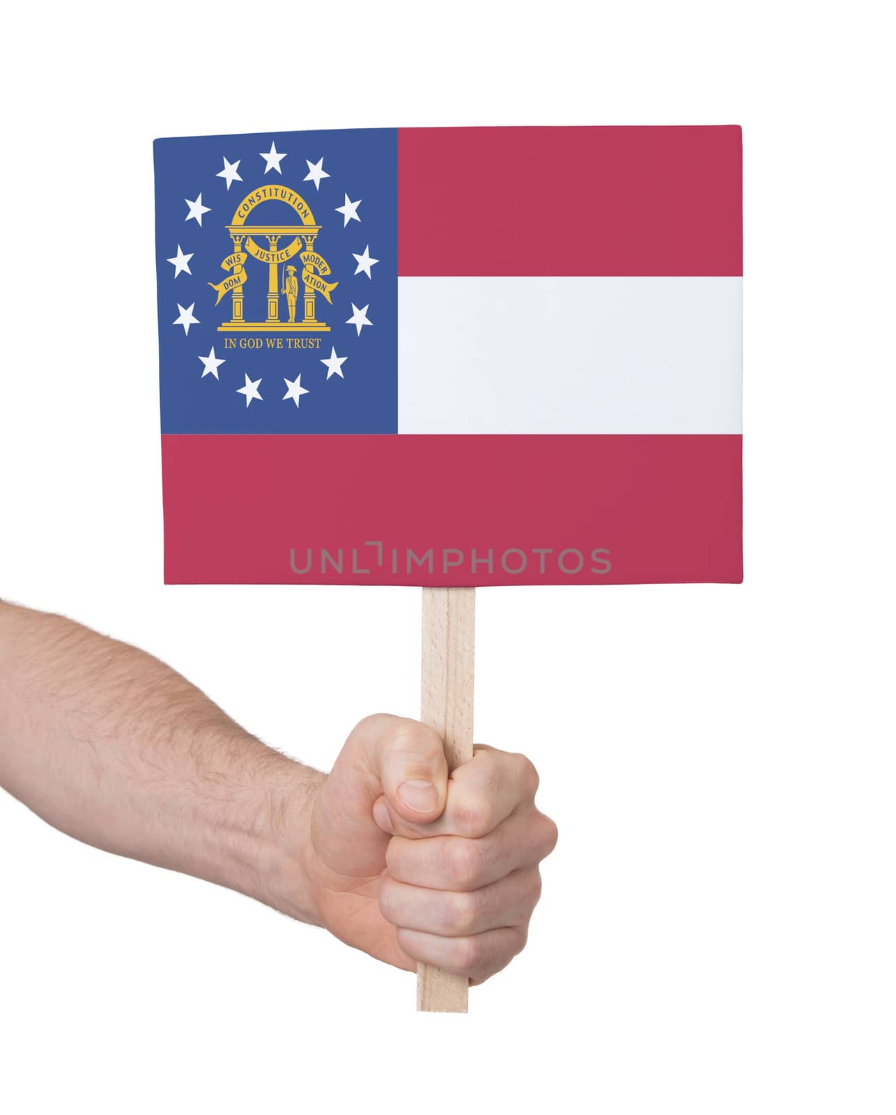 Hand holding small card, isolated on white - Flag of Georgia