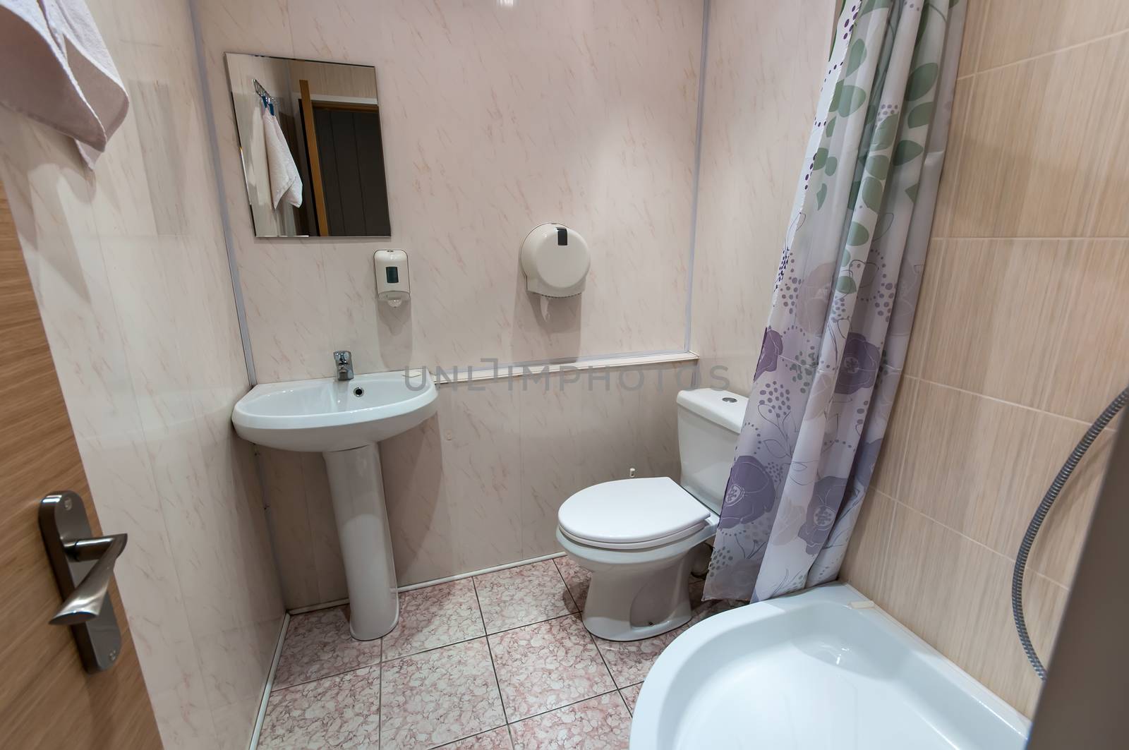 combined bathroom with sink toilet and shower tray
