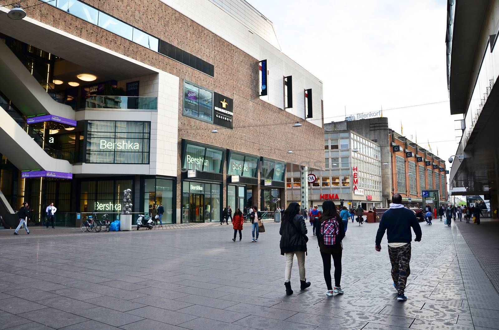 The Hague, Netherlands - May 8, 2015: People shopping at market street in the center of The Hague by siraanamwong