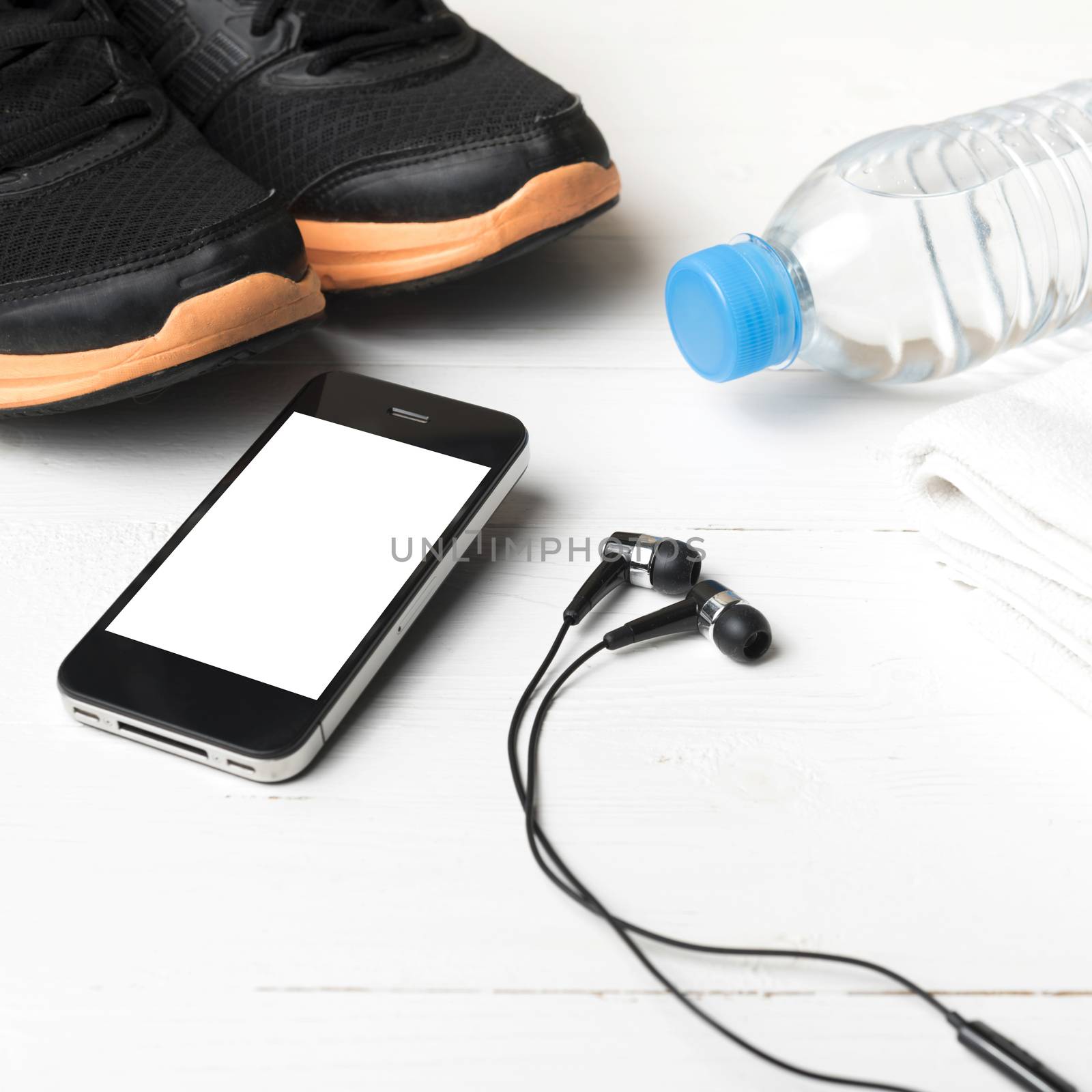 fitness equipment:running shoes,water bottle,towel,smart phone