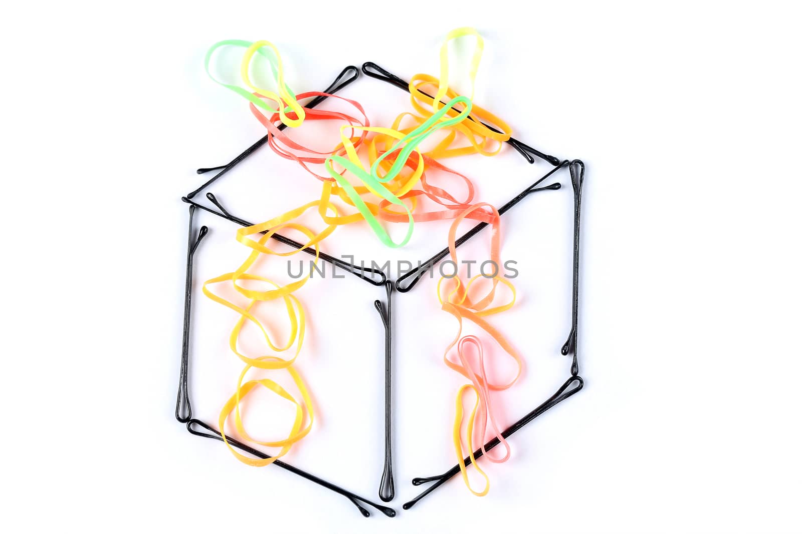 creative gift box made by hair clips and colorful rubber bands on white background