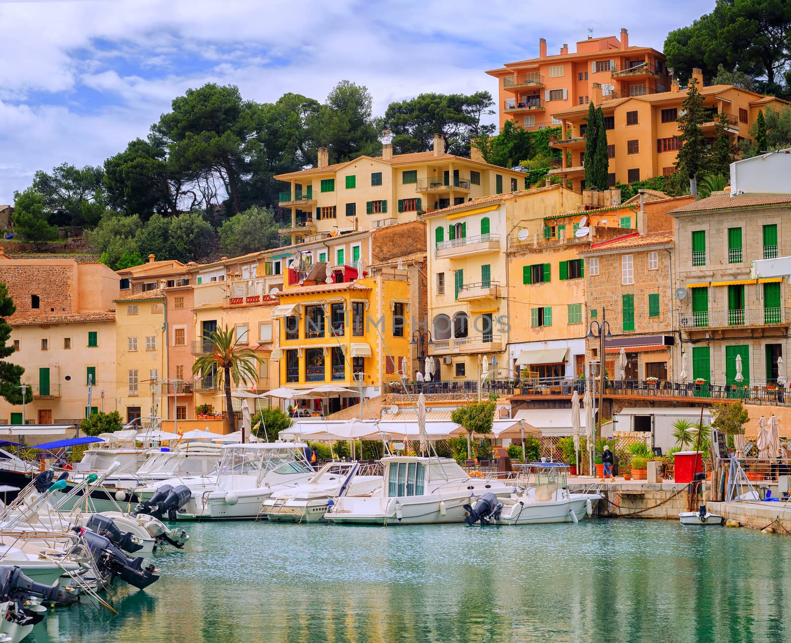 Motor boats and traditional waterside houses in Puerto Soller, Mallorca, Spain
