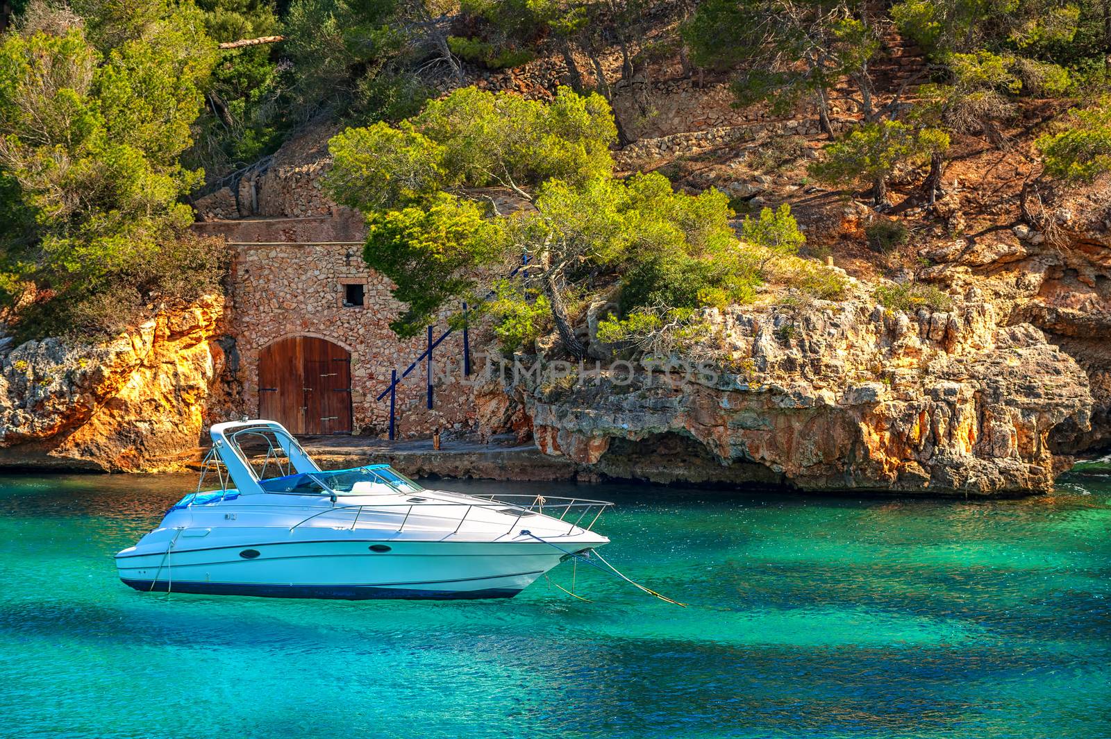 Beautiful white yacht in harbor of Cala Figuera, Mallorca, Spain by GlobePhotos