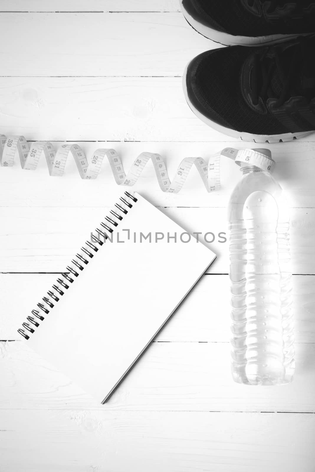 running shoes,measuring tape,drinking water and notebook black a by ammza12