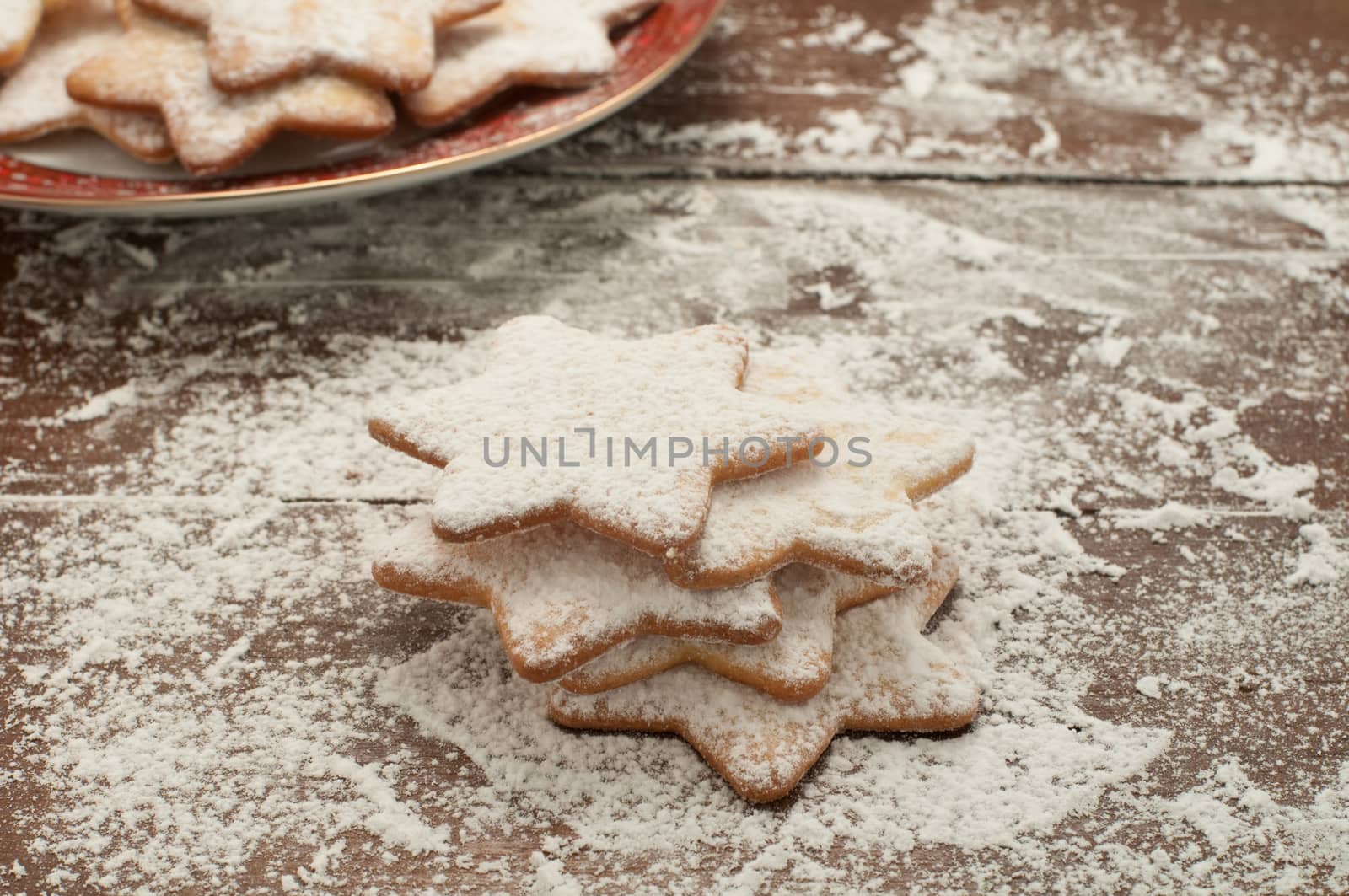 Christmas cookies in the shape of star with flour and butter, italy