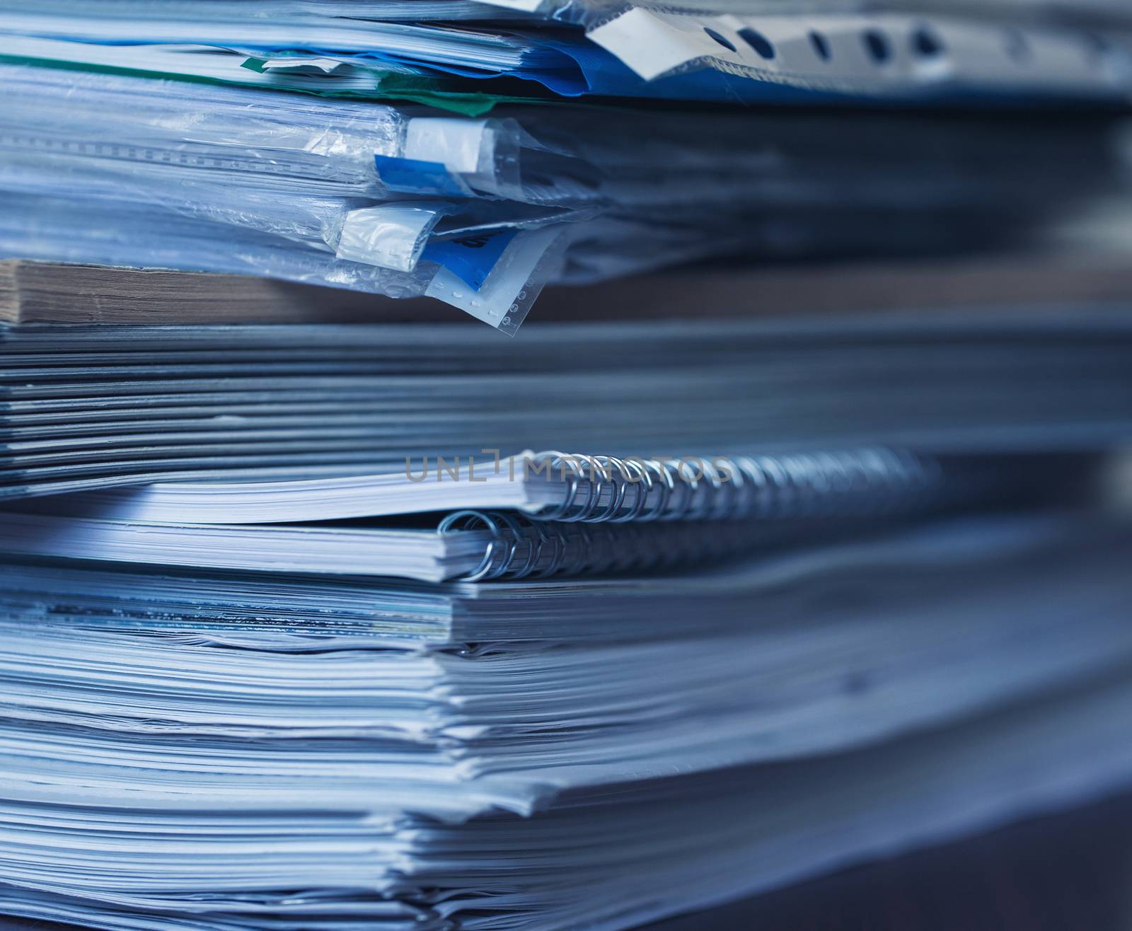 Accounting and taxes. Large pile of magazine and books closeup