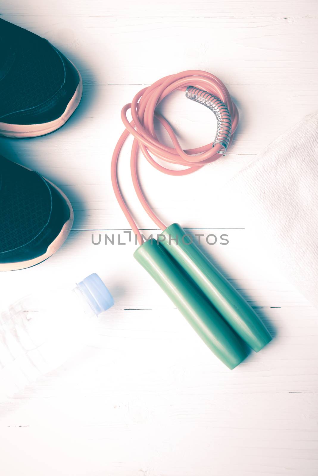 fitness equipment:running shoes,water bottle,towel,rope vintage style