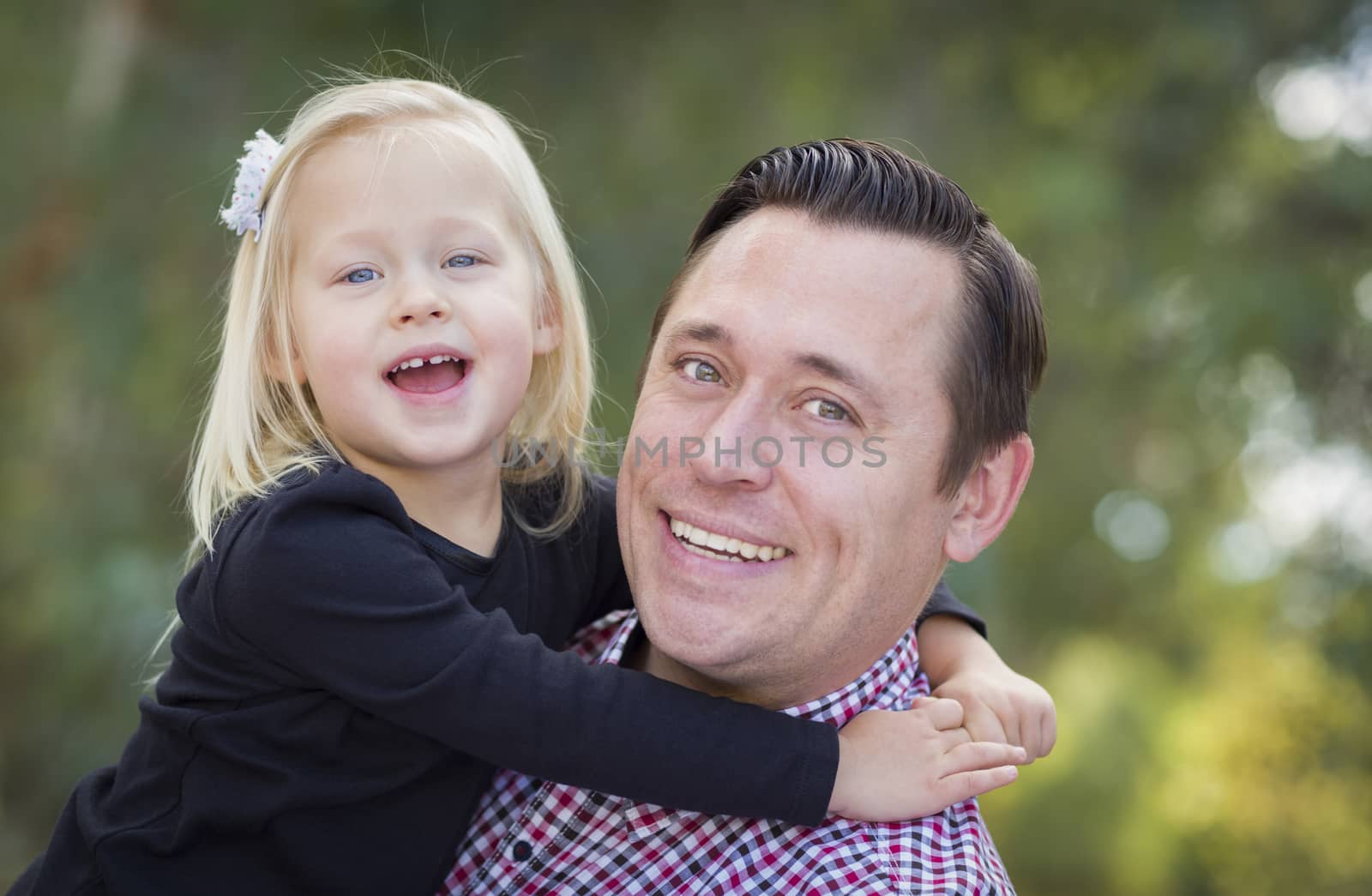 Adorable Little Baby Girl Having Fun With Daddy Outdoors.