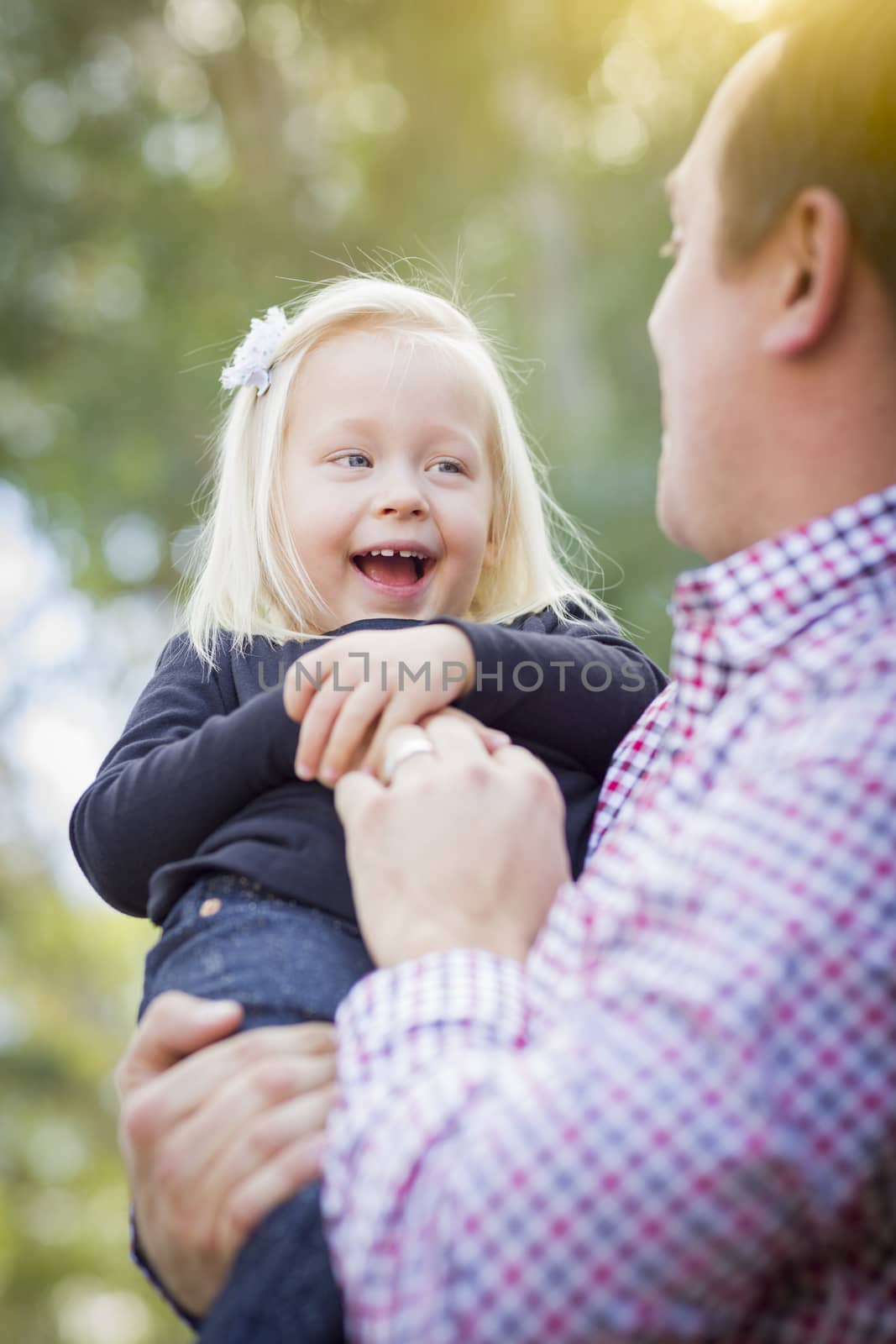 Adorable Little Baby Girl Having Fun With Daddy Outdoors.