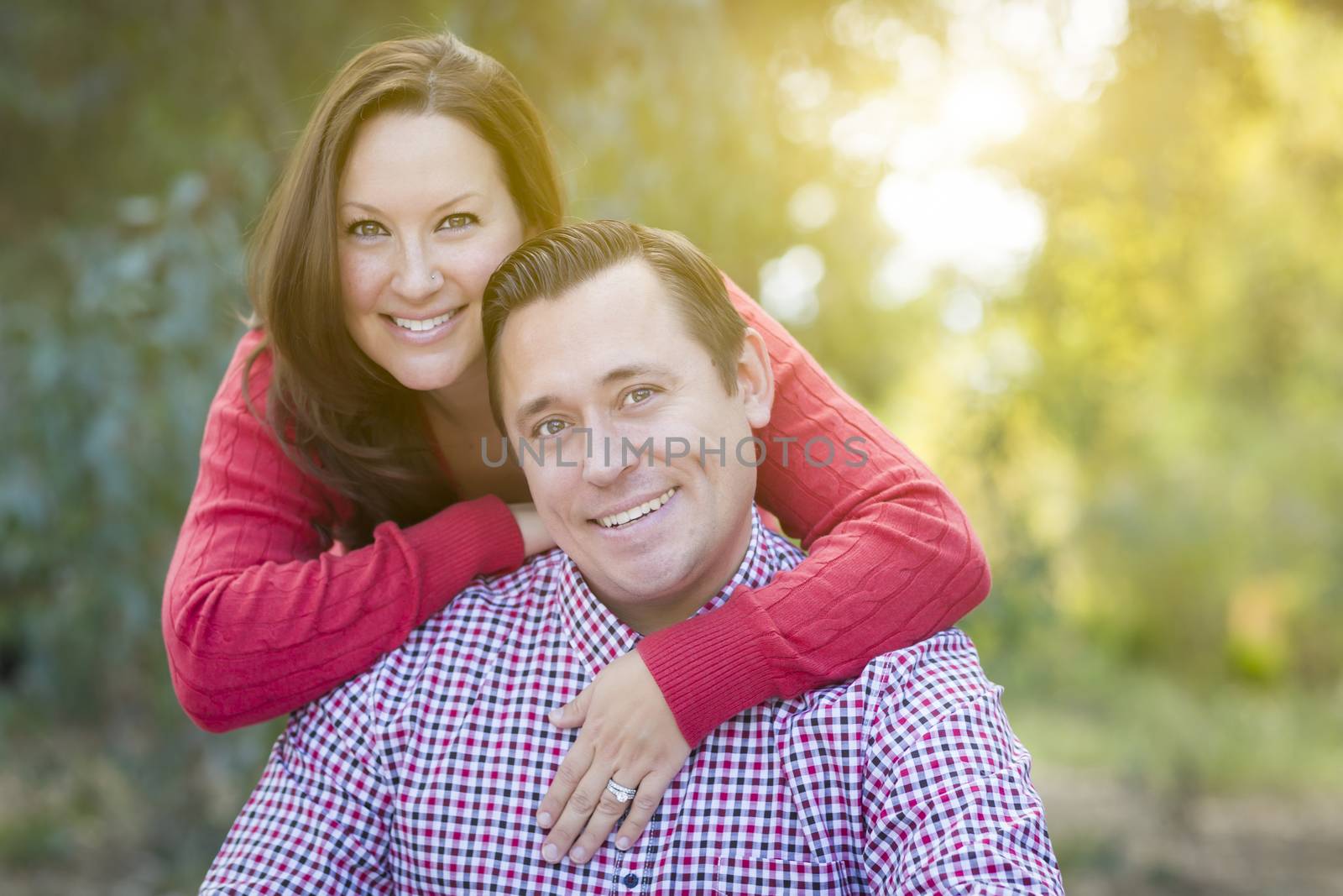 Attractive Happy Caucasian Couple Portrait Outdoors.