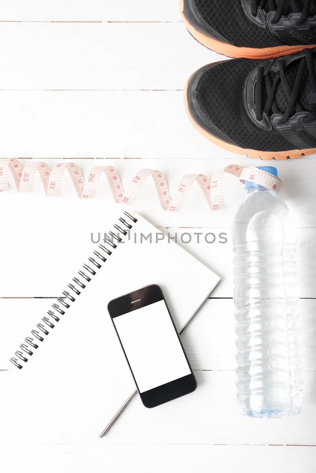 running shoes,measuring tape,drinking water,notebook and phone by ammza12