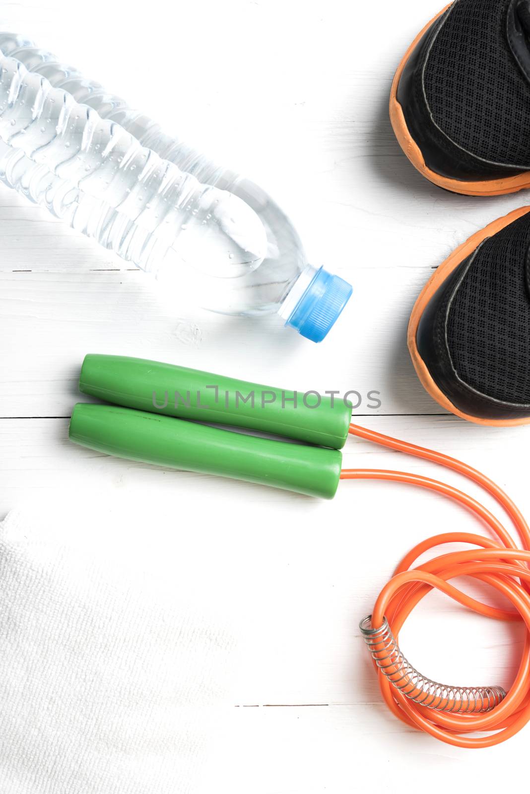 fitness equipment:running shoes,water bottle,towel,rope
