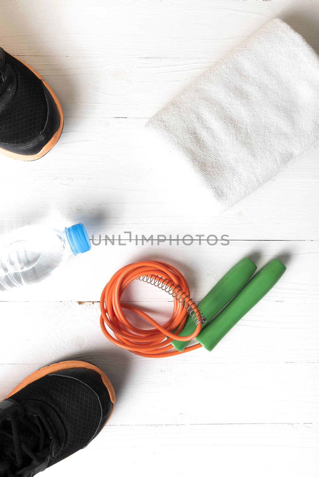 fitness equipment:running shoes,water bottle,towel,rope