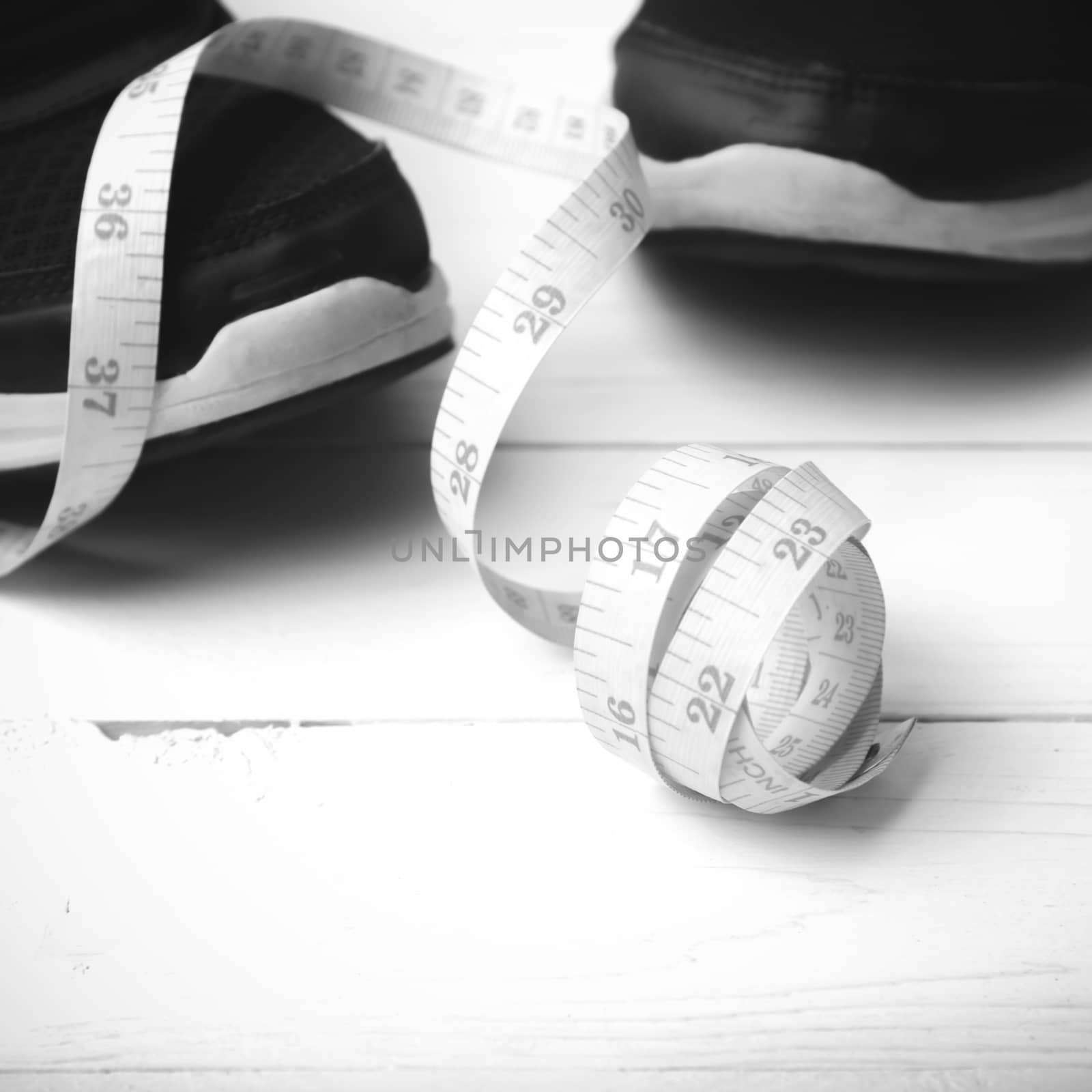 running shoes and measuring tape black and white tone color styl by ammza12