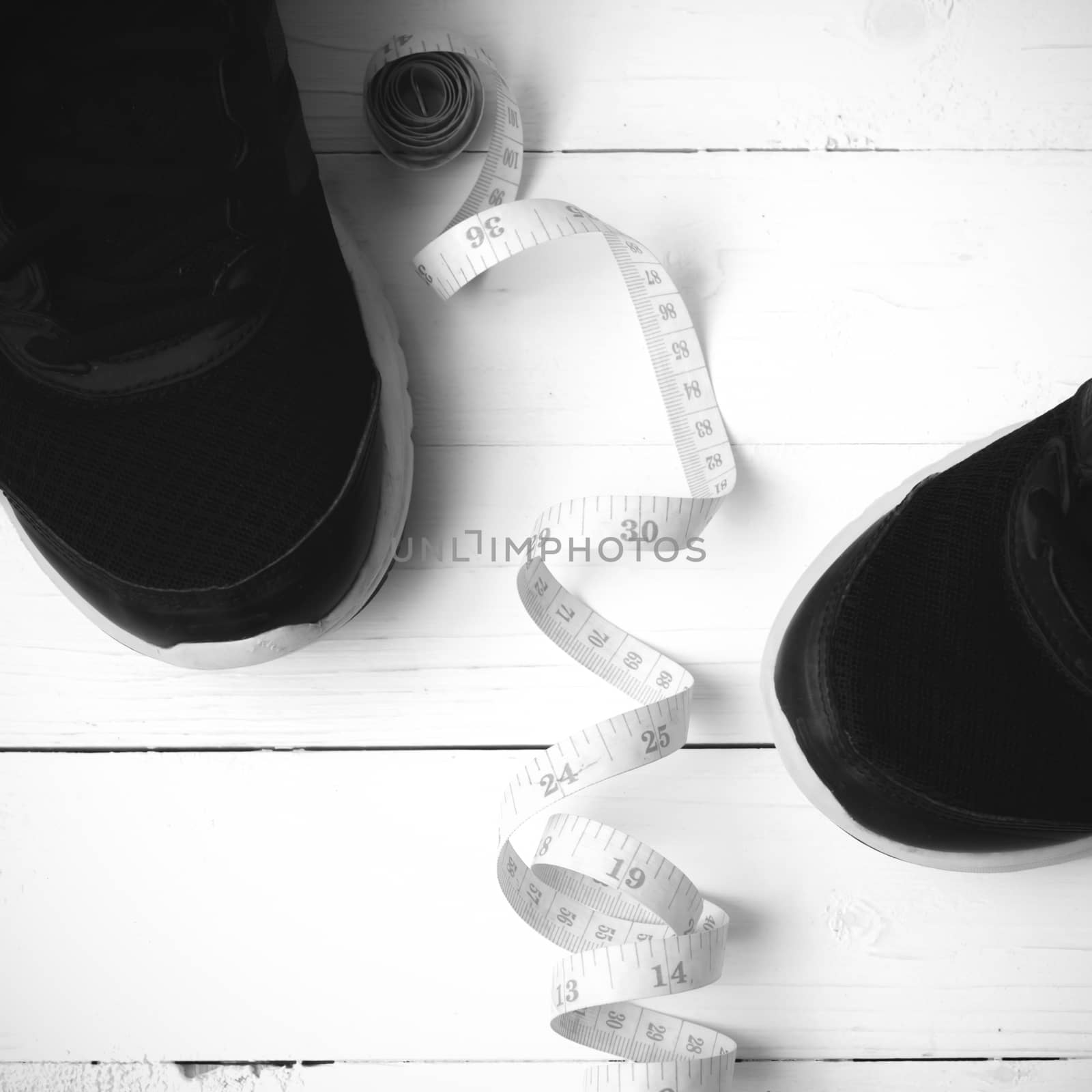 running shoes and measuring tape black and white tone color styl by ammza12