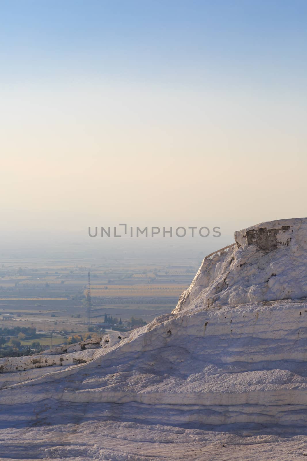 View of white hill in Pamukkale on clear sky background, Denizli, Turkey.