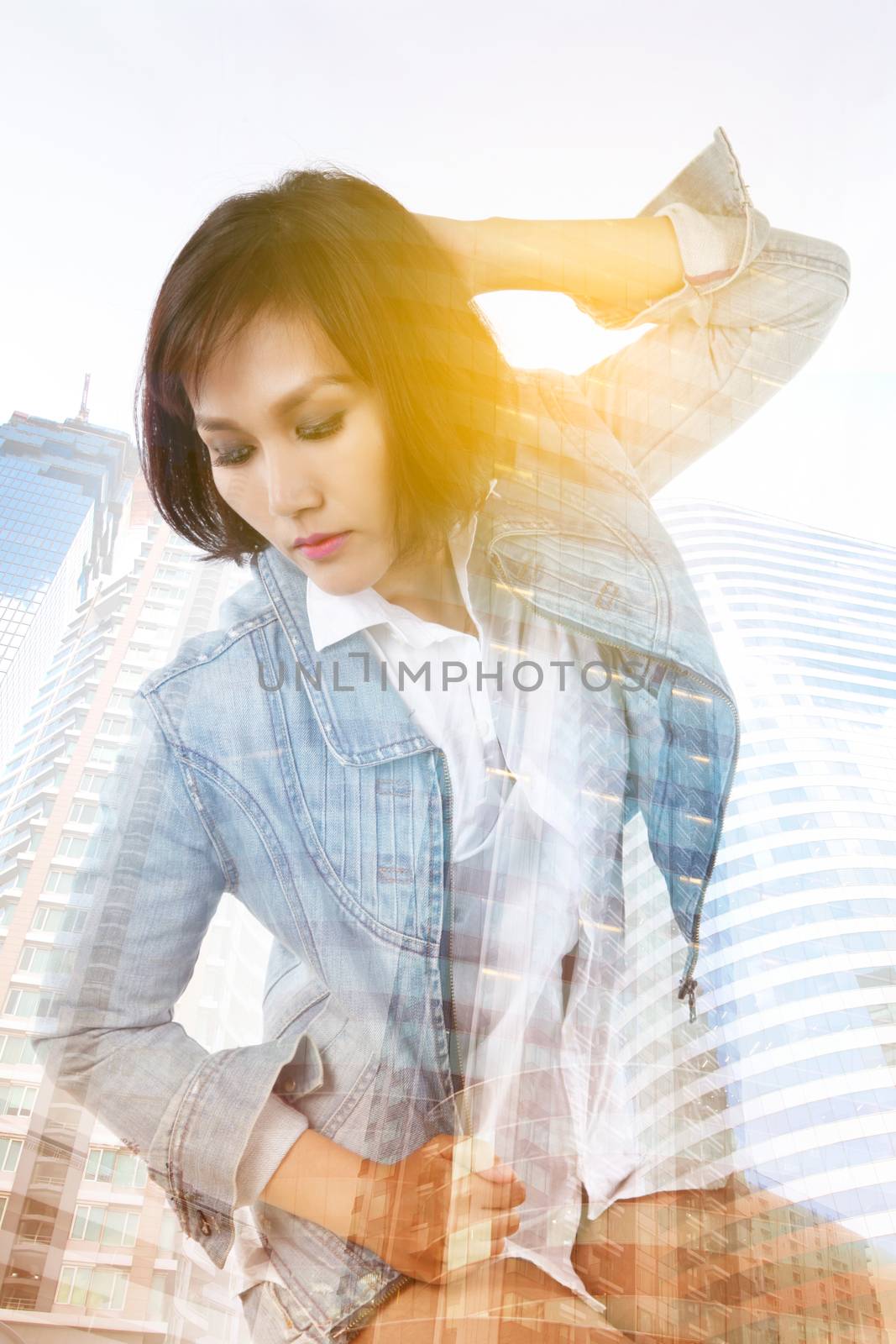 Double exposure of Asian lady and building skyscraper - lifestyle in city concept