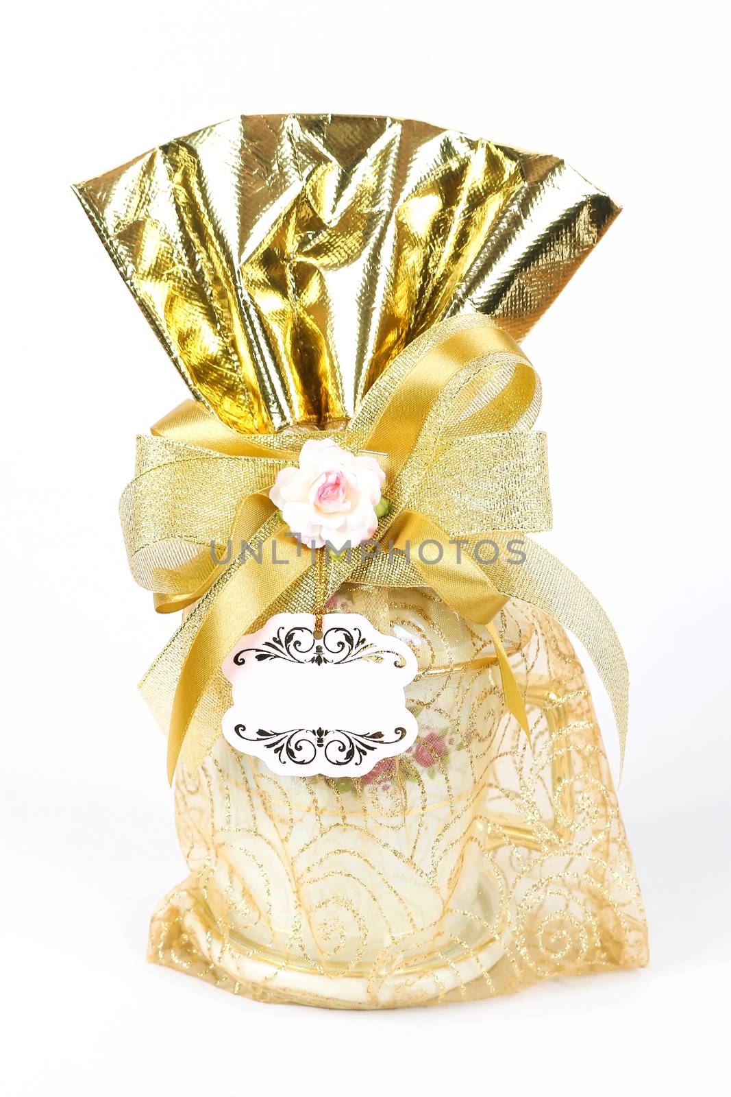 golden gift sack of tea cup on white background