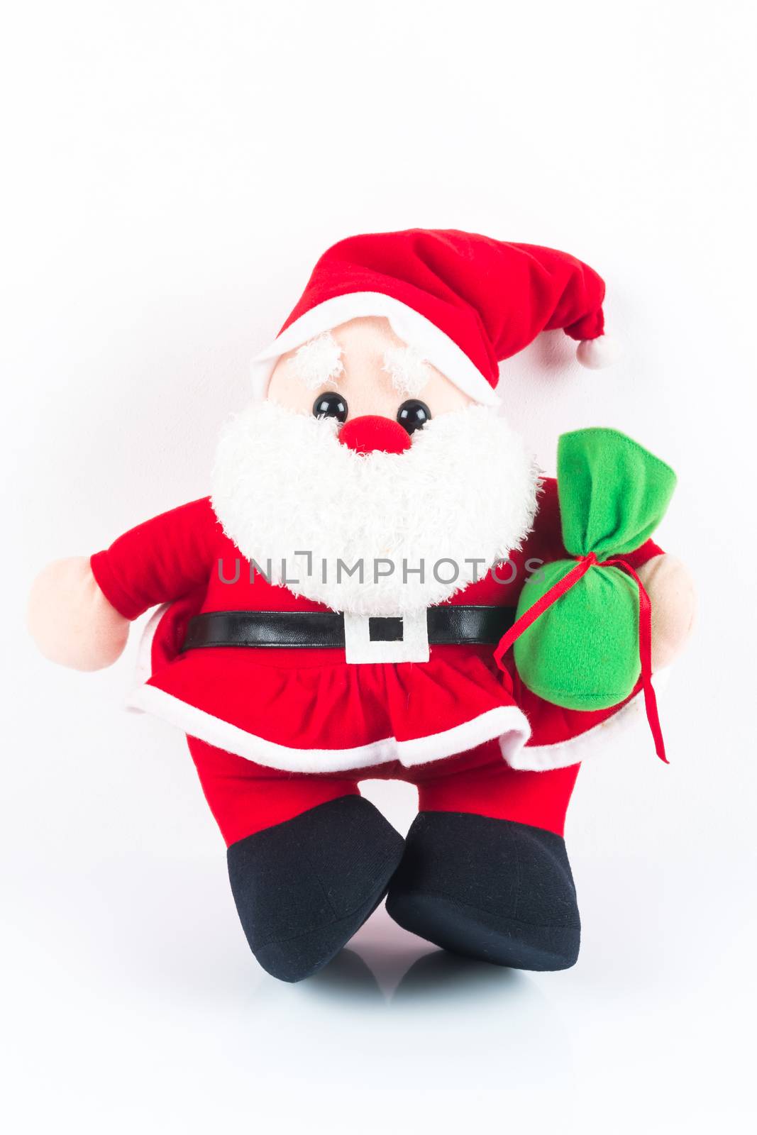 Santa Claus doll with green sack on white background