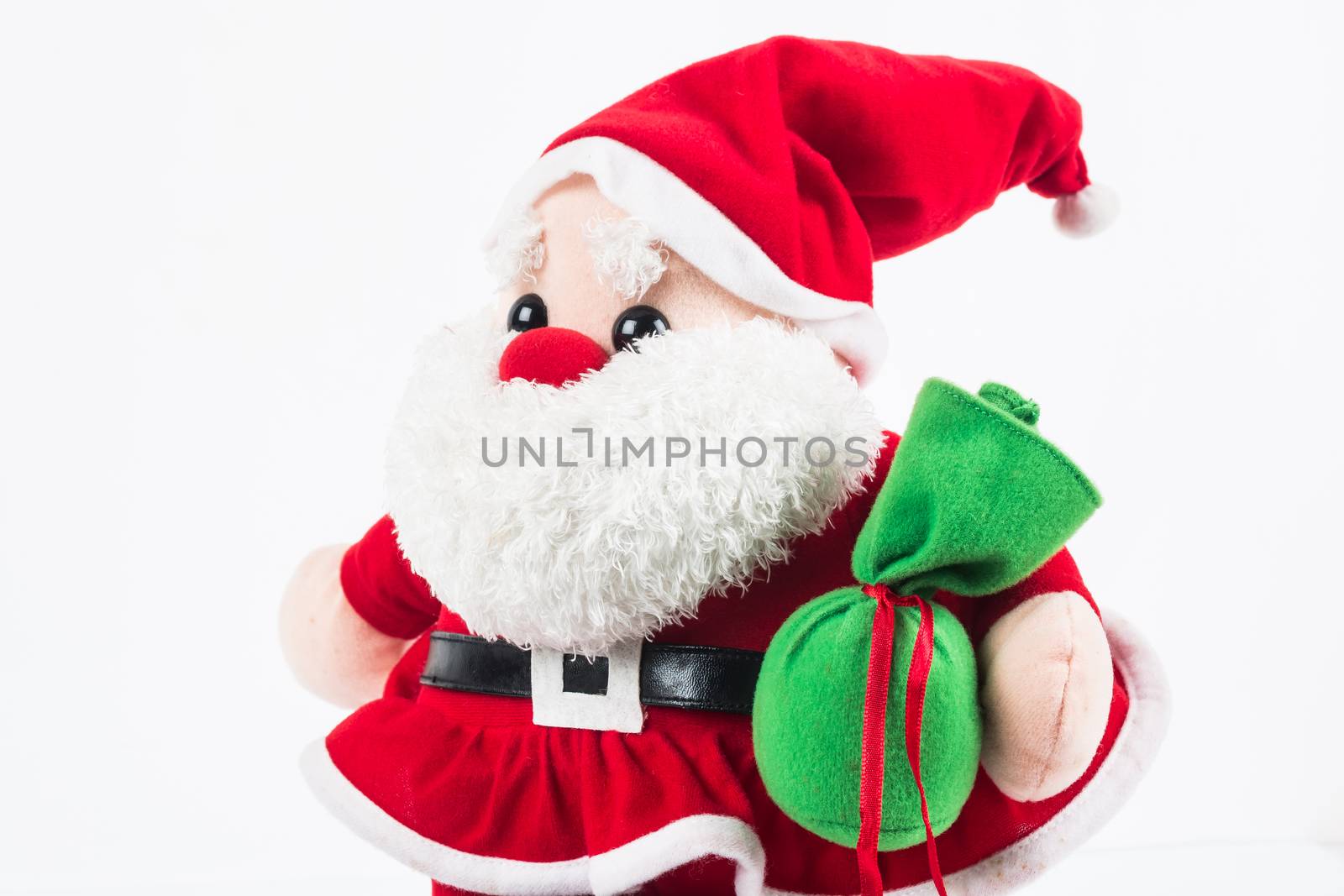 Santa Claus doll with green sack on white background