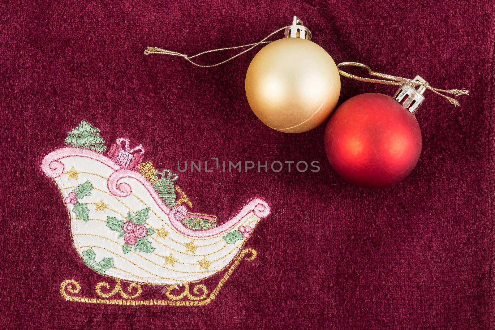 gold and red ball on christmas decorated towel