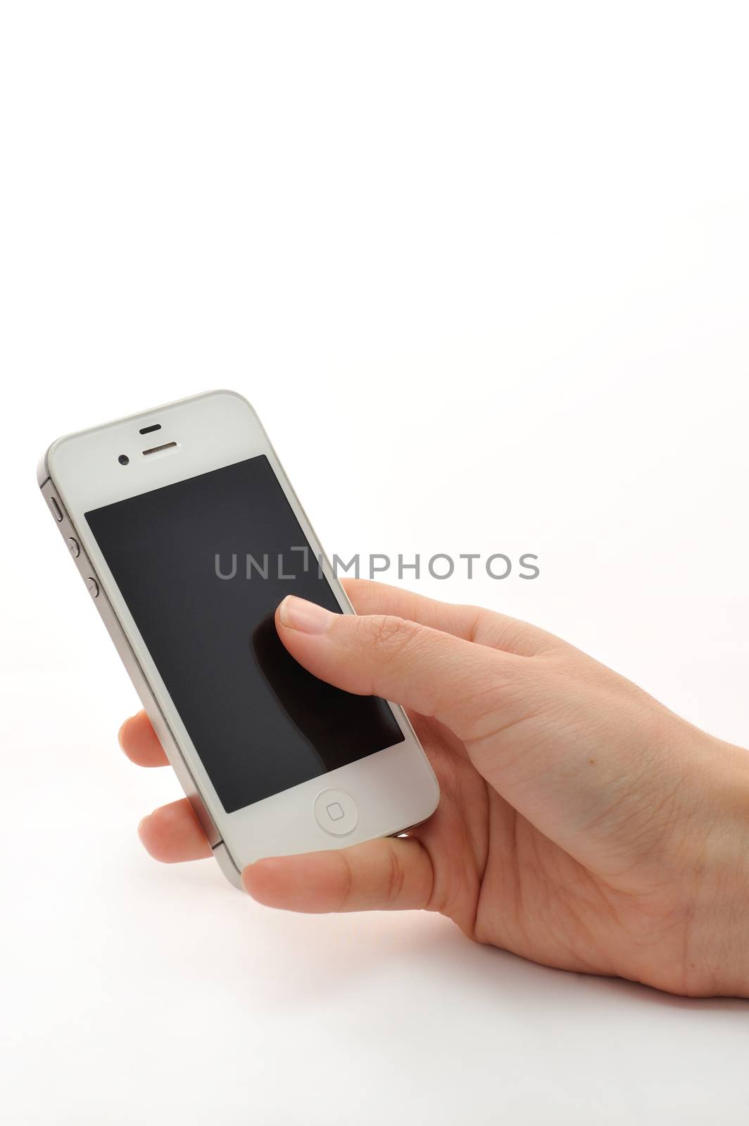 Hand holding white phone