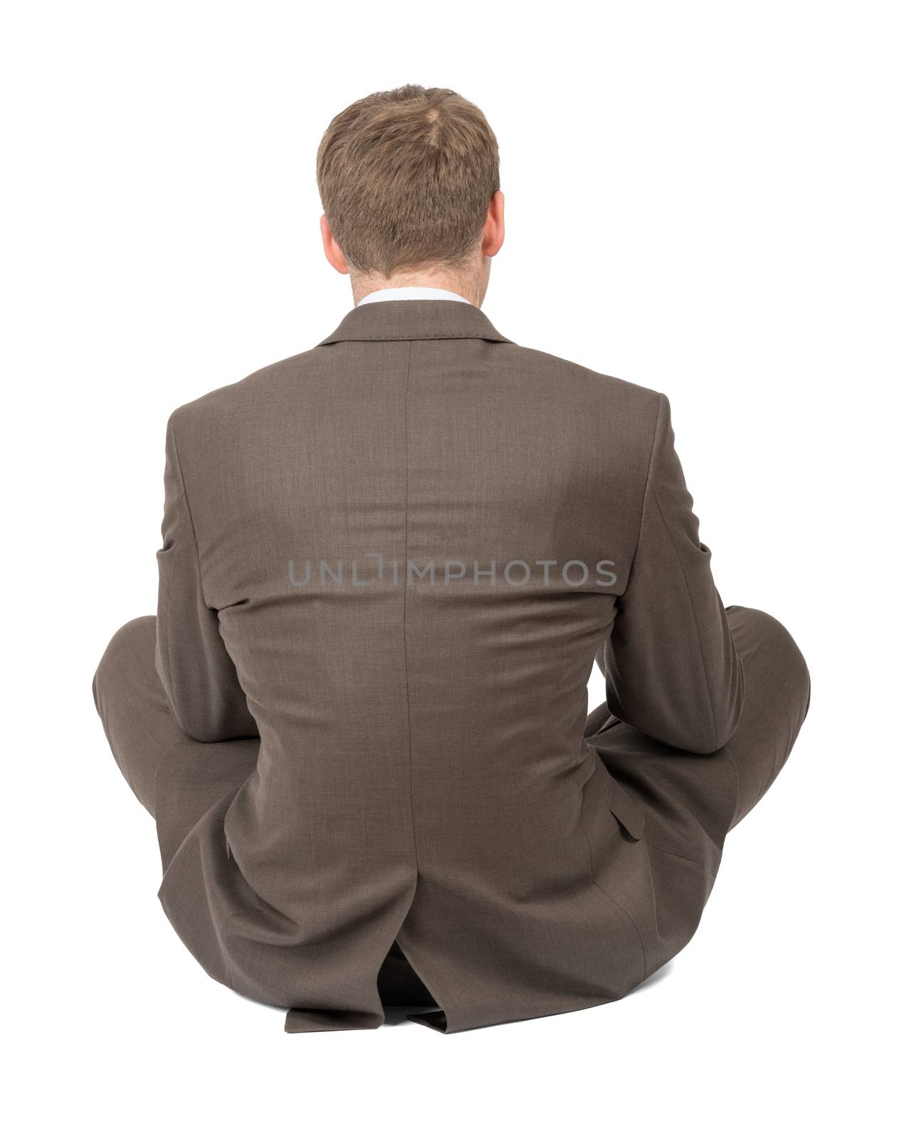Businessman in lotus posture on white, rear view by cherezoff