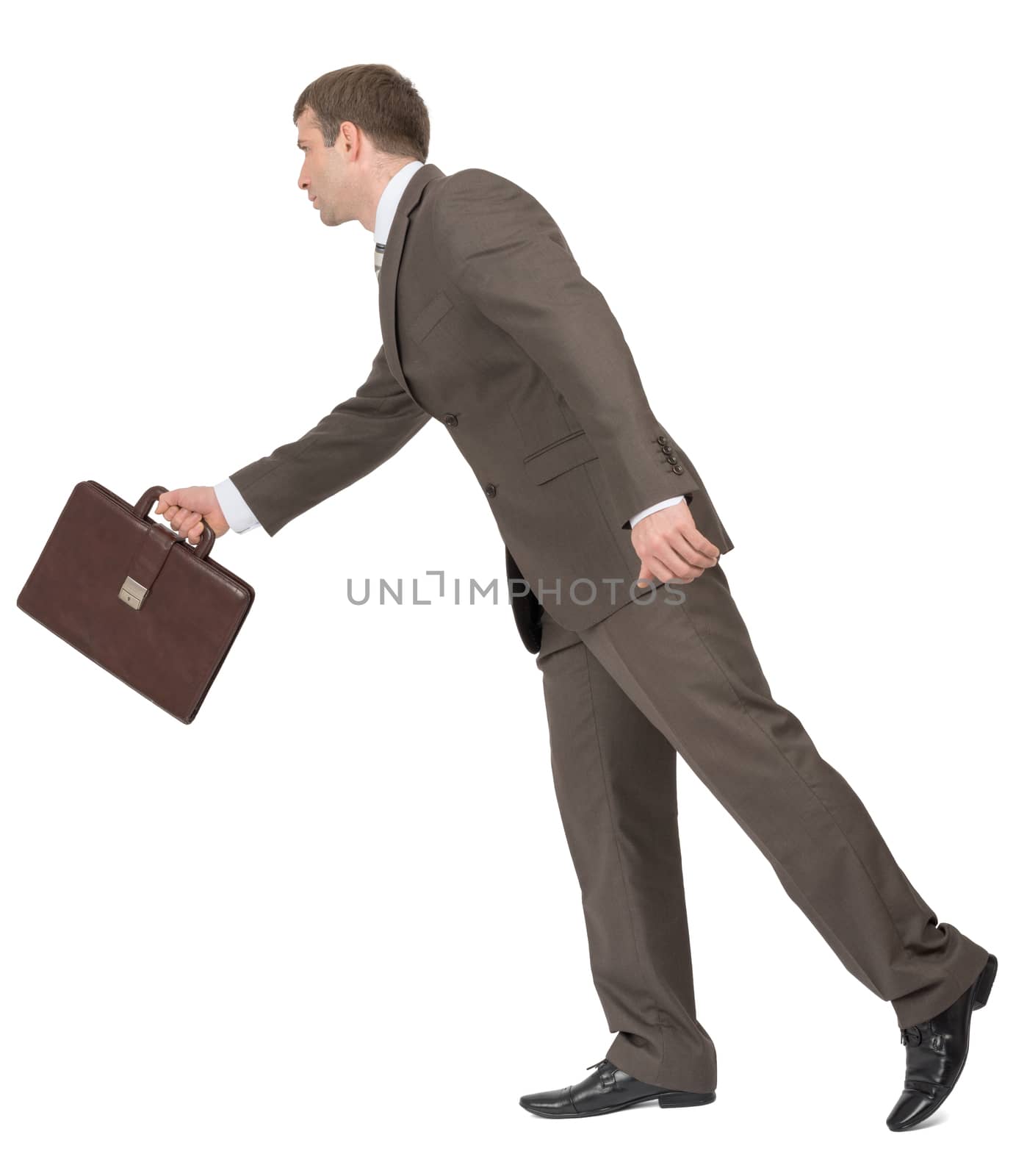 Businessman walking forward on isolated white background, side view