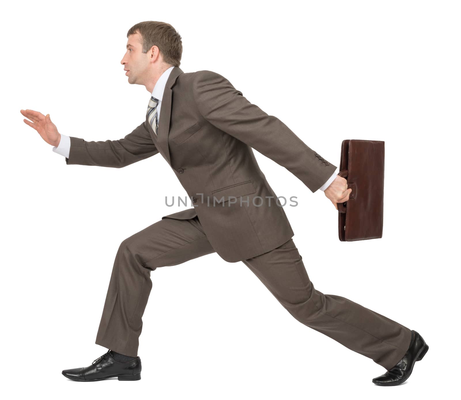 Businessman running forward, side view by cherezoff