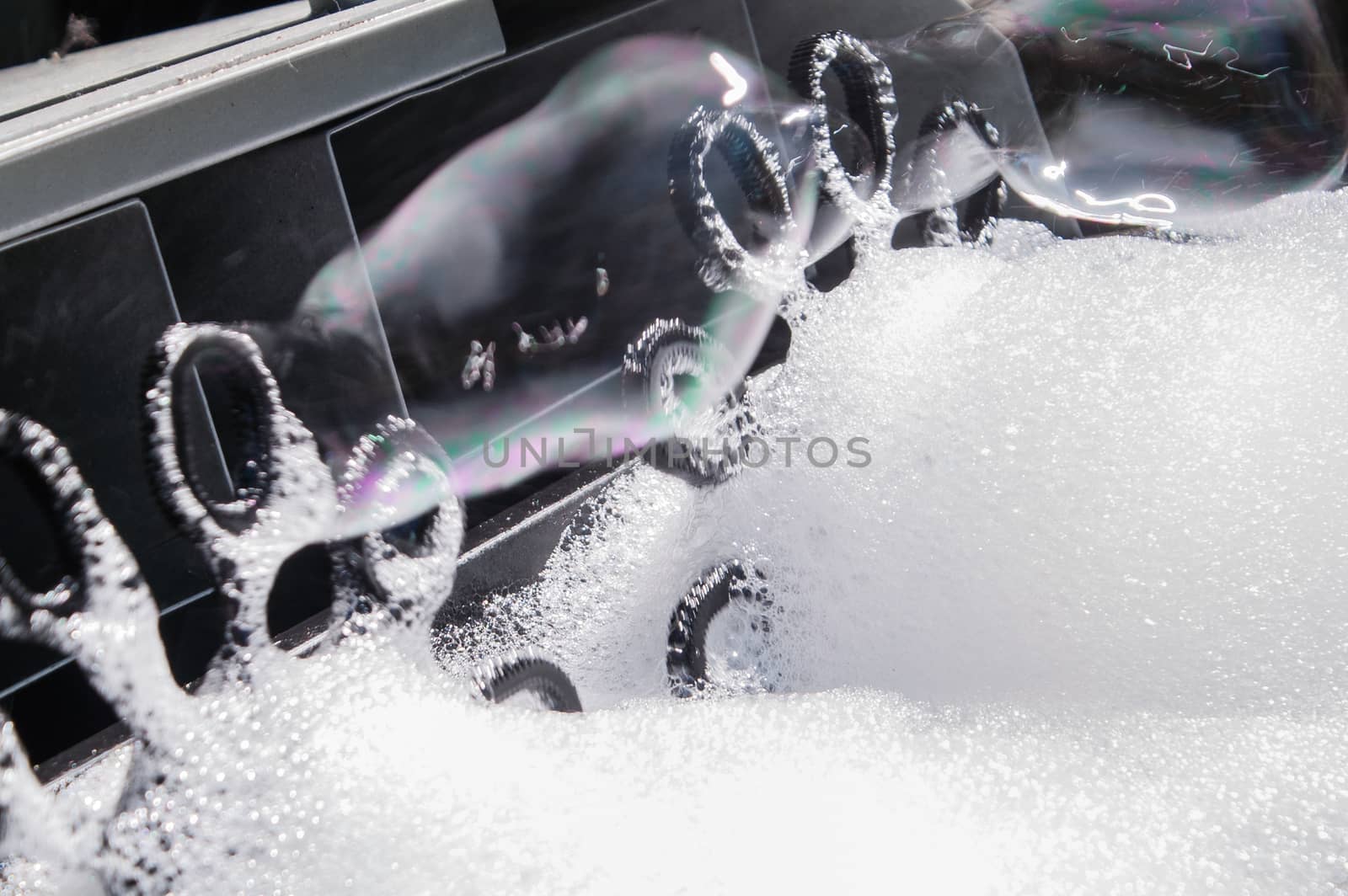 process of production by car of soap bubbles with foam