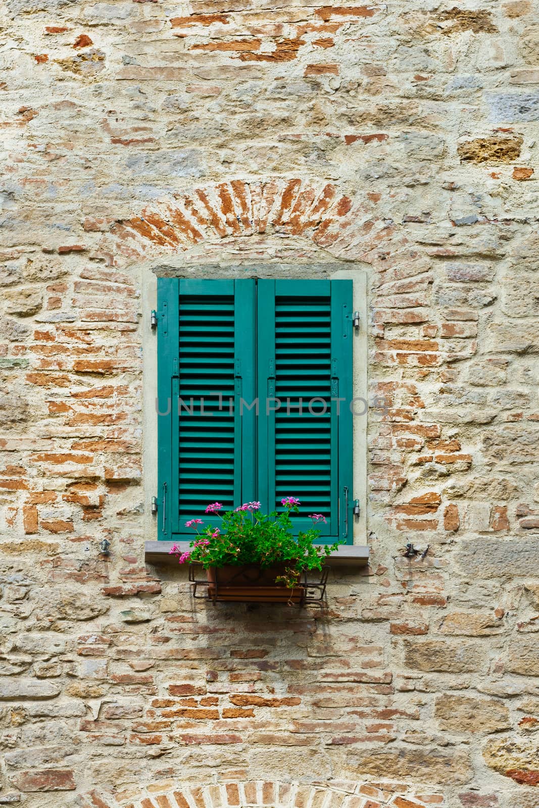 Italian Window with Closed Wooden Shutters, Decorated With Fresh Flowers