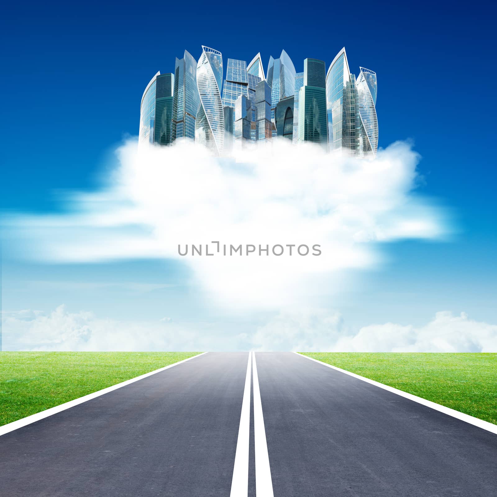 City on clouds in sky above highway road