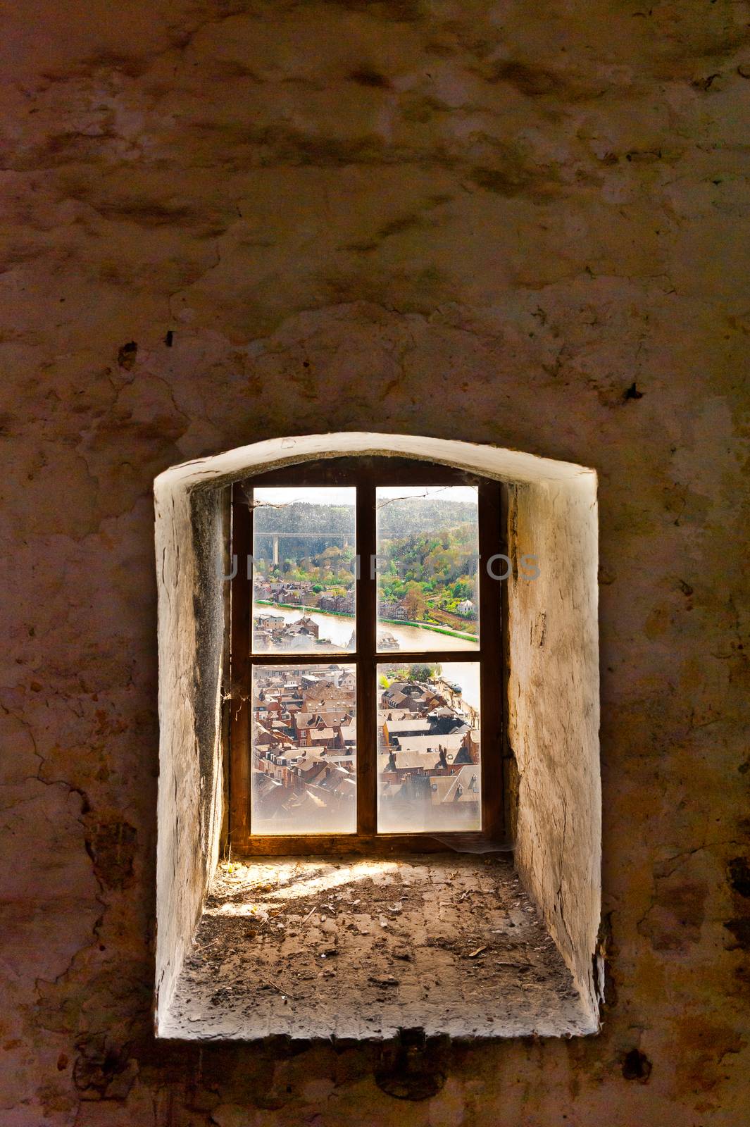 Aerial View from Dirty, Covered with Cobwebs, Window of the Fortress to the Embankment of the River Meuse in the Belgian City of Dinant