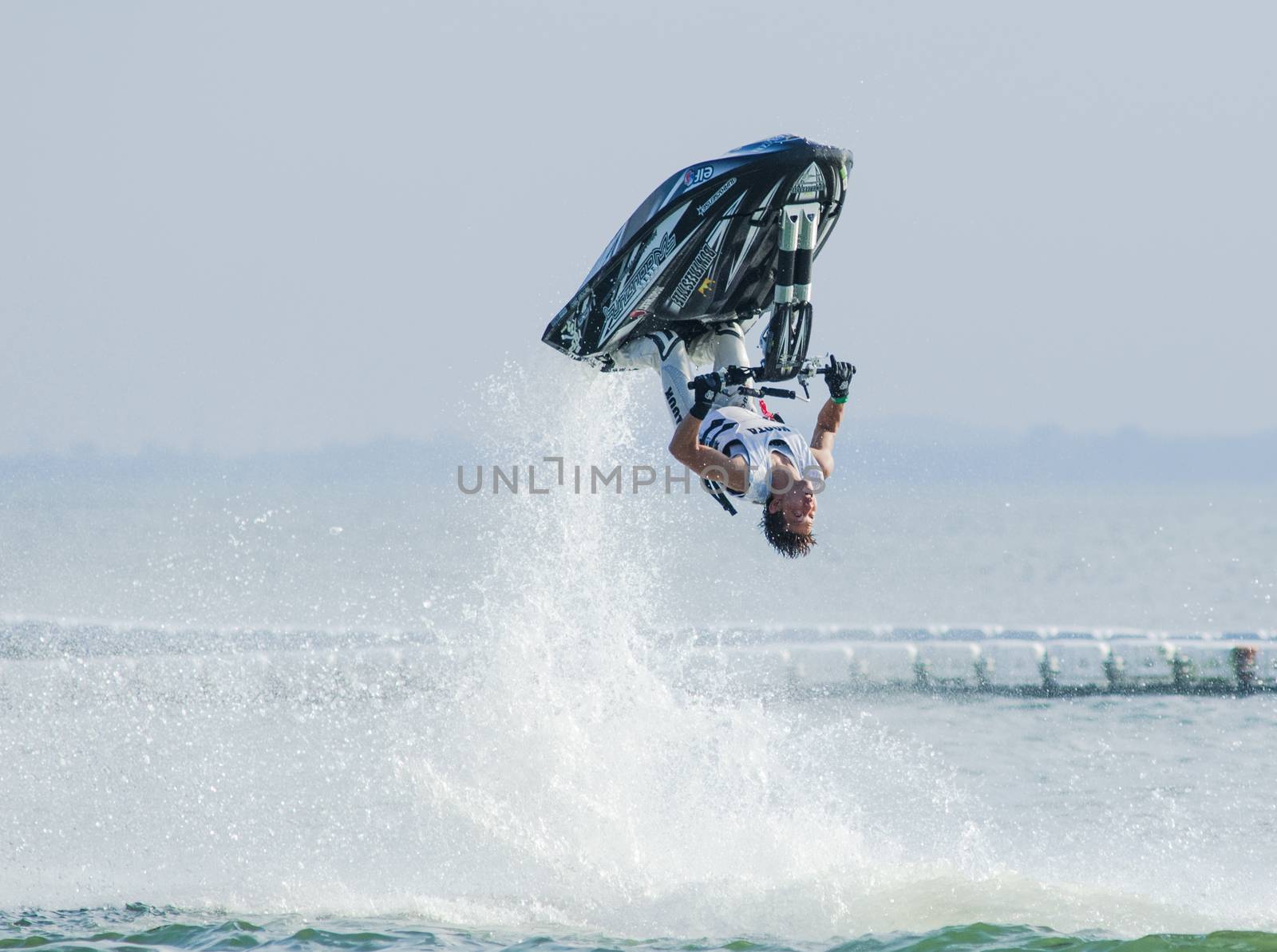 Pattaya, Thailand - December 6, 2015: Taiji Yamamoto from Japan during his performance at the freestyle competition during the International Jet Ski World Cup at Jomtien Beach, Pattaya, Thailand.