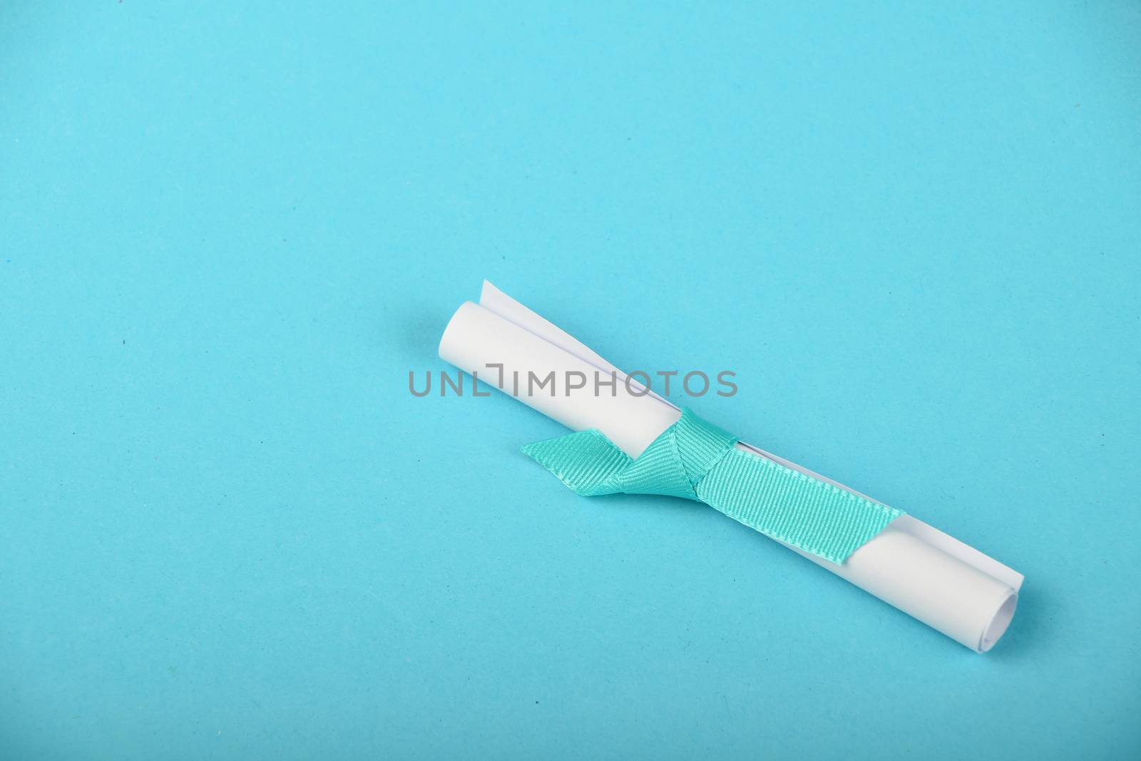 One white paper scroll message on blue background by BreakingTheWalls