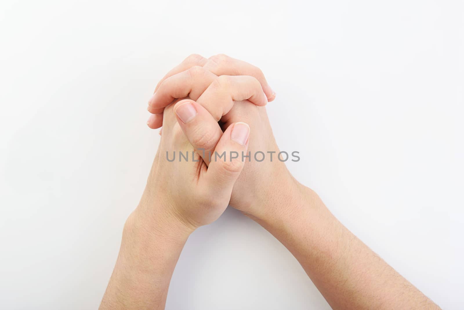 hands together resting on top of a  white plain background