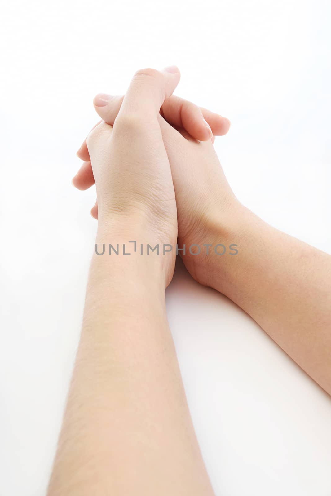 hands resting on top of a  white plain background