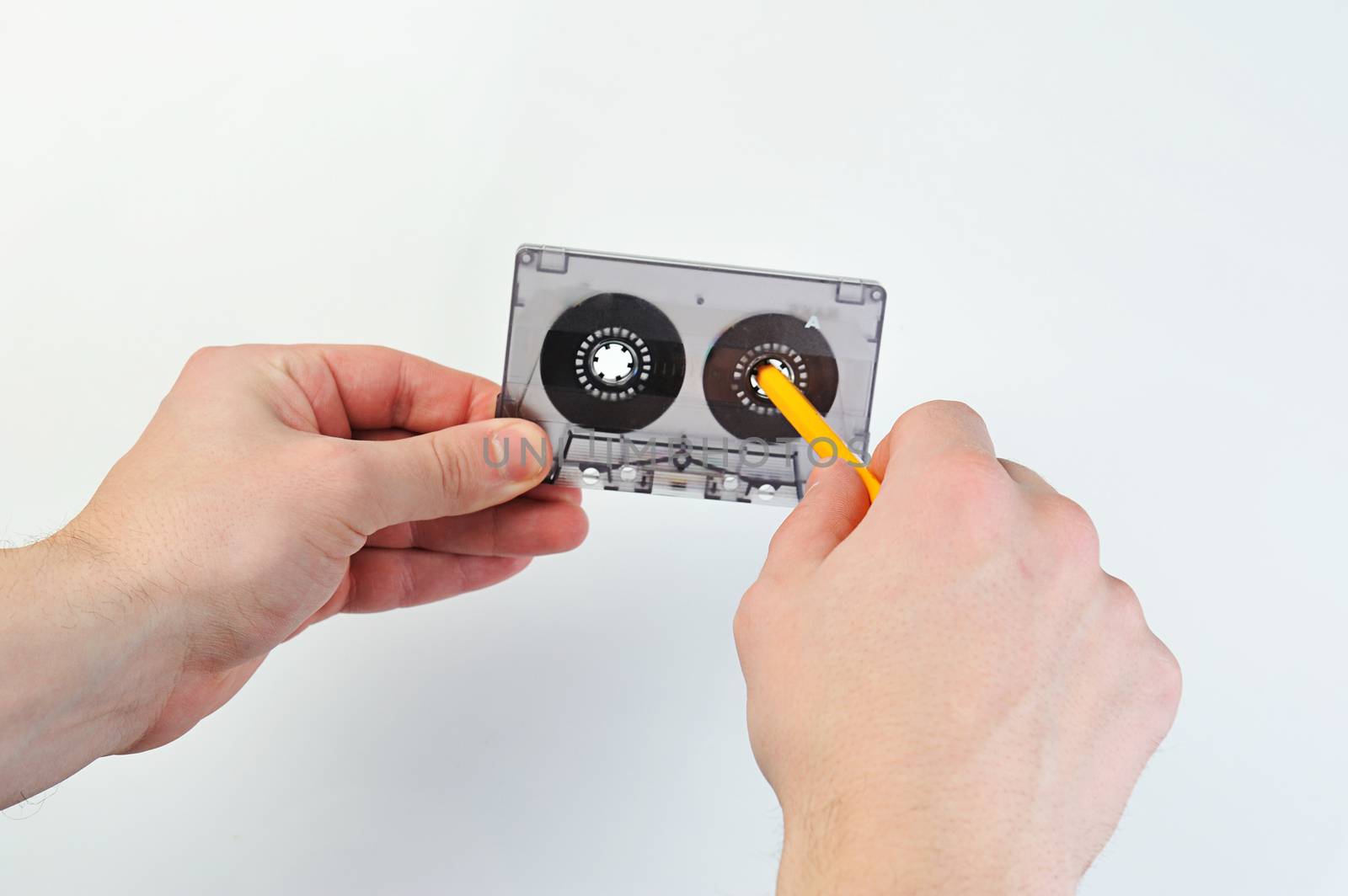 rewind audio casette with tape on a white background