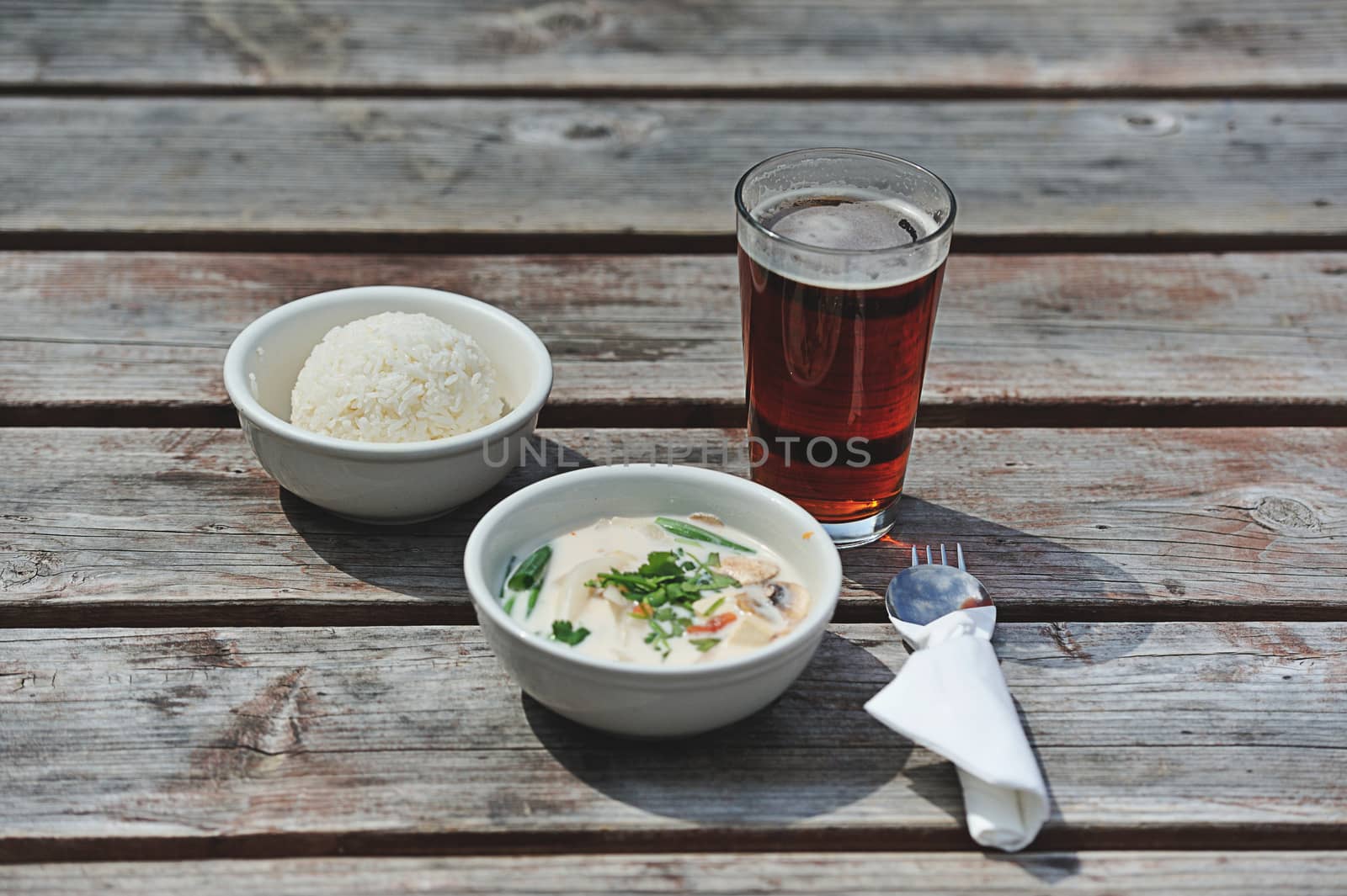 Lunch of rice with root beer and spicy soup