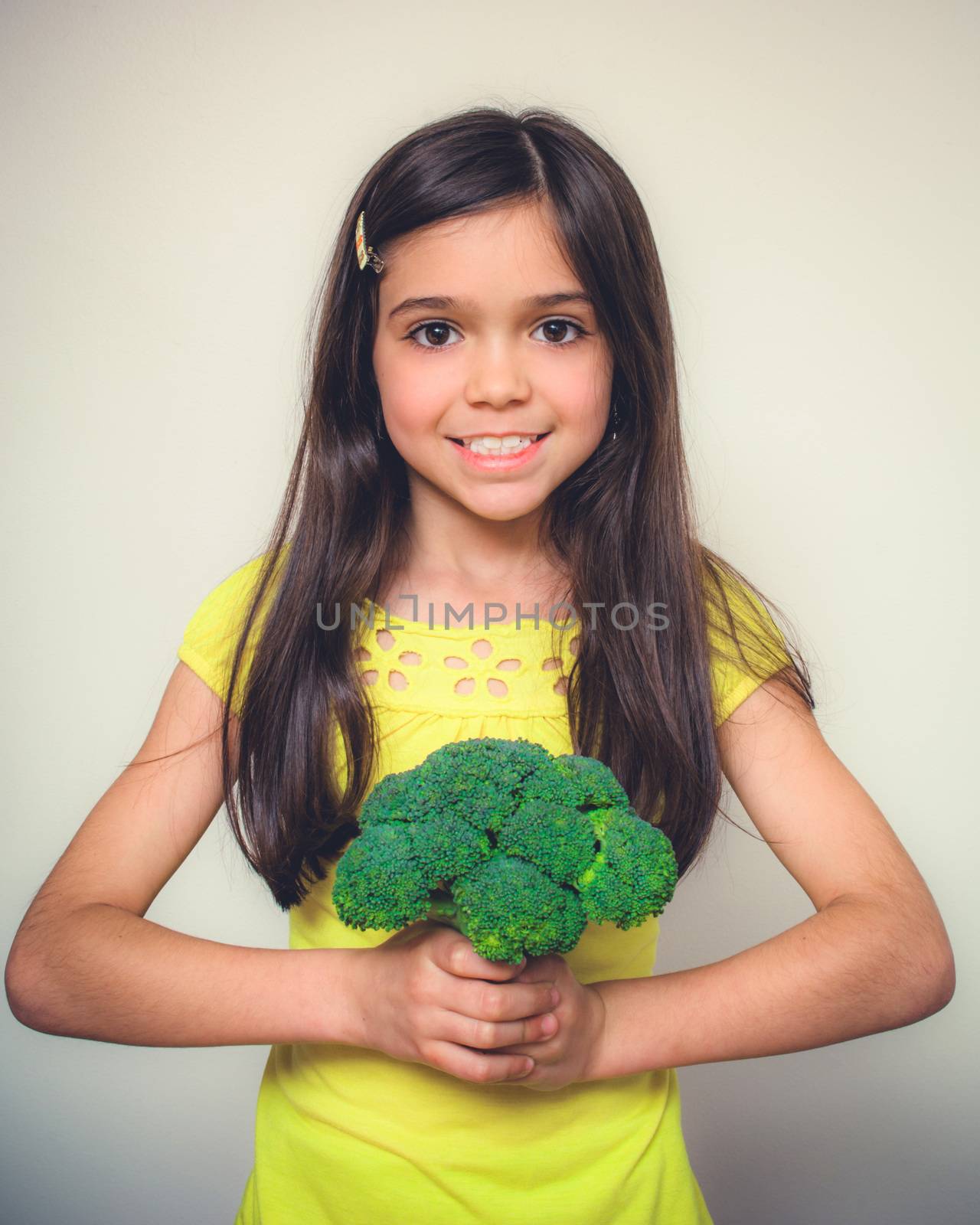 Young girl with borwn hair acts in studio.