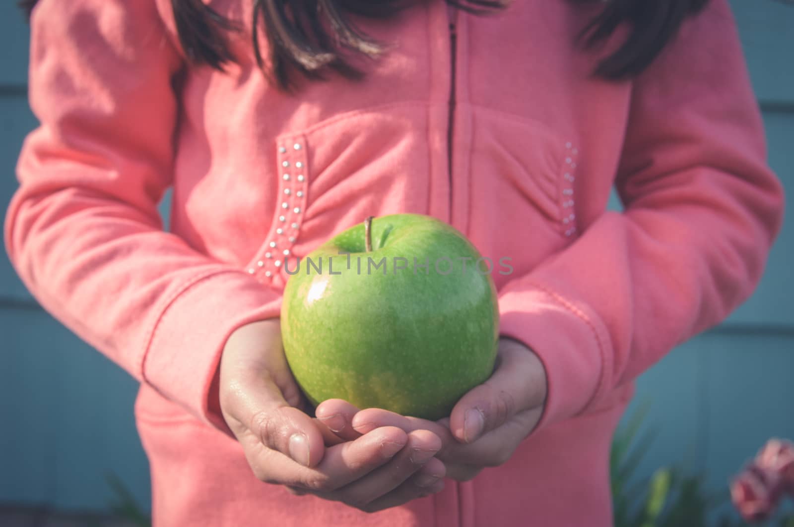 Young girl playing outside.