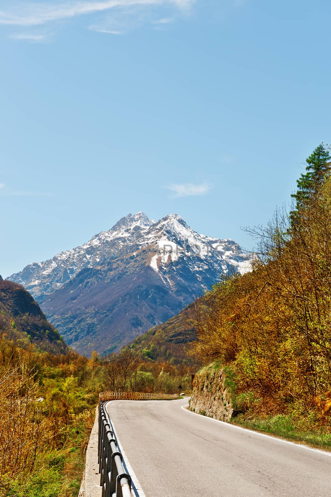 Asphalt Road in Piedmont on the Background of Snow-capped Alps