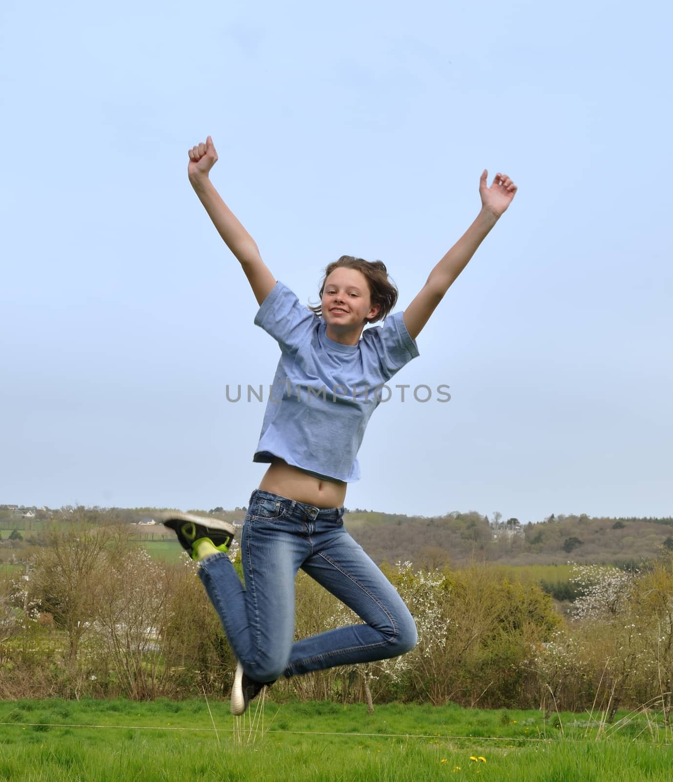 Girl jumping in a garden