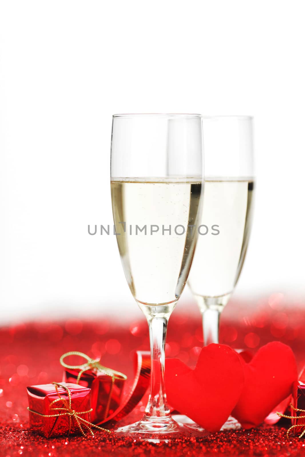 Two glasses of champagne with red decor, Valentines day concept