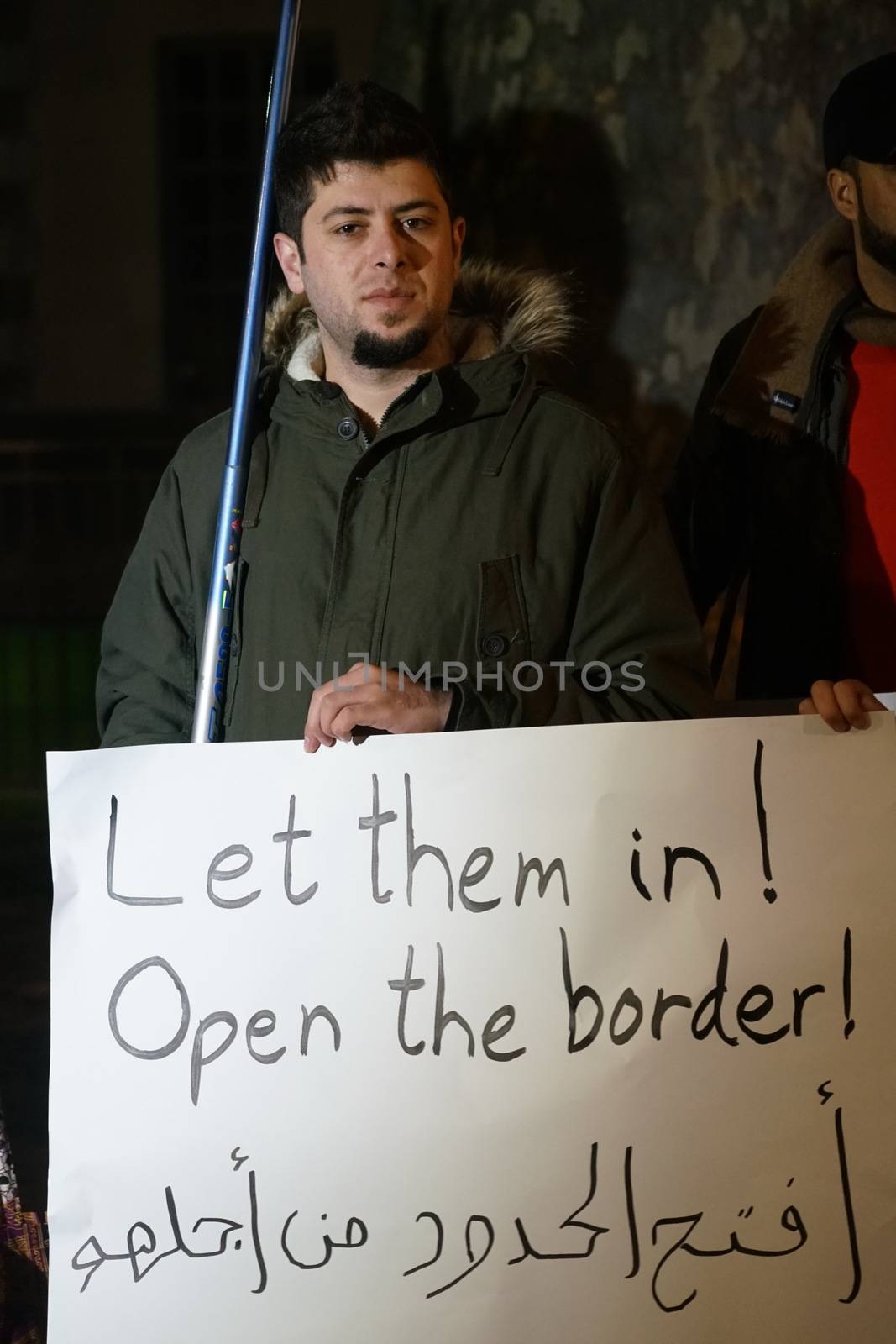 ENGLAND, London: People in support of the refugees gathered in London on December 12, 2015 to hold a Christmas vigil outside Downing Street.The demonstrators held candles and signs calling for refugees to be welcomed.