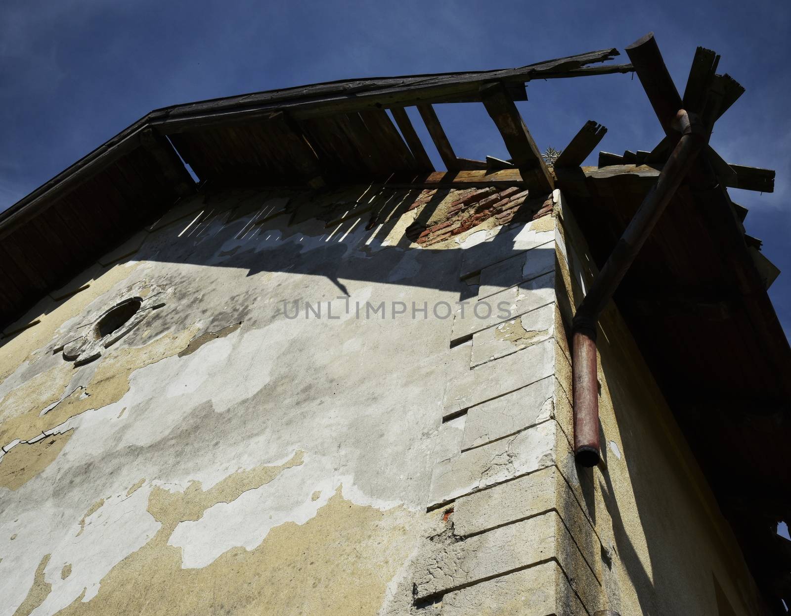 bottom view of the ramshackle roof of the old house