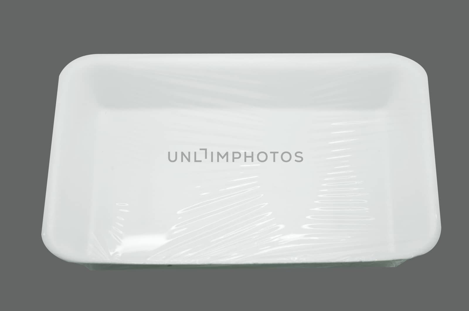 Wrapped white styrofoam food tray