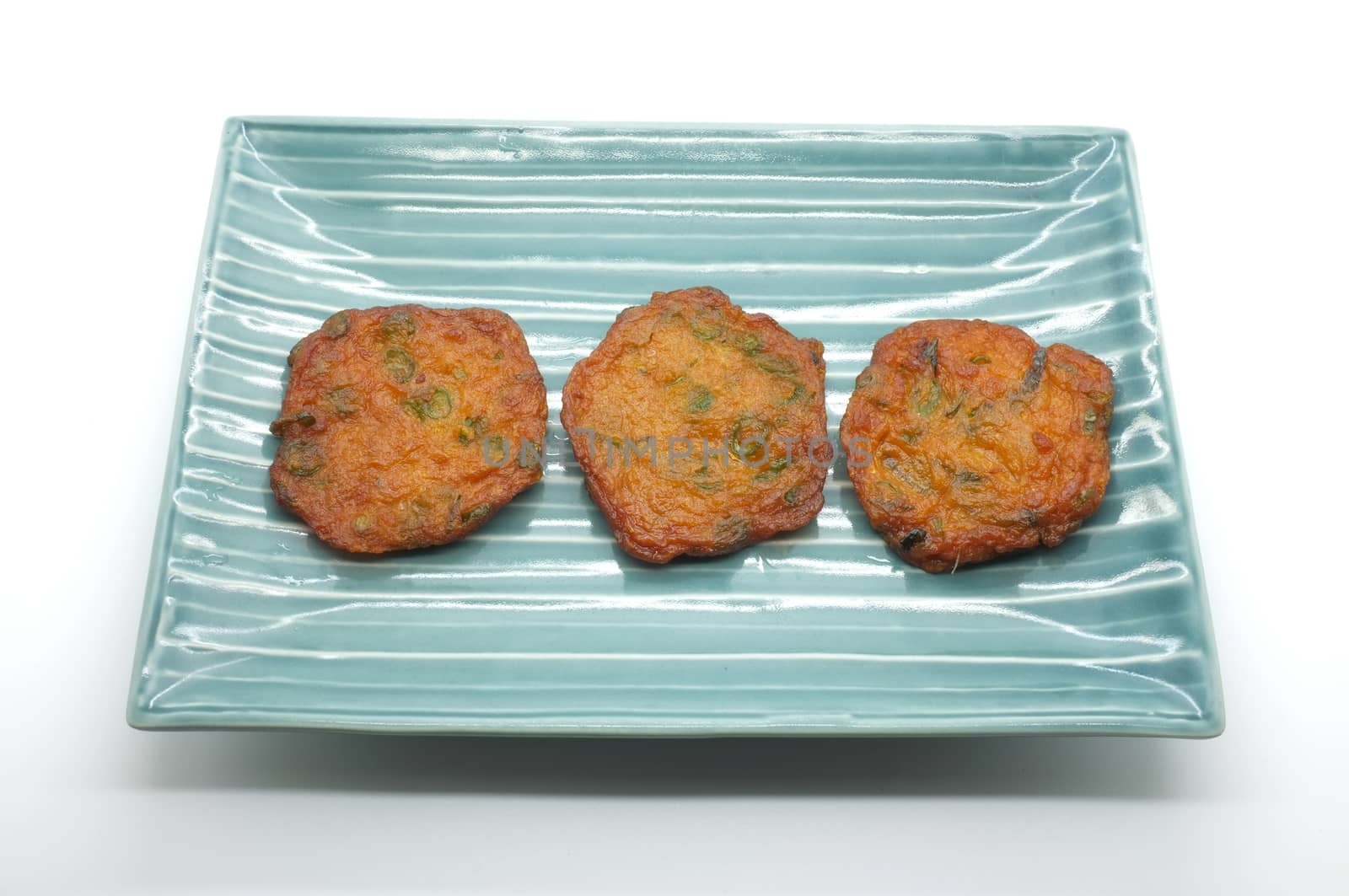 Fried fish patty, spicy fish ball on ceramic dish, thai food