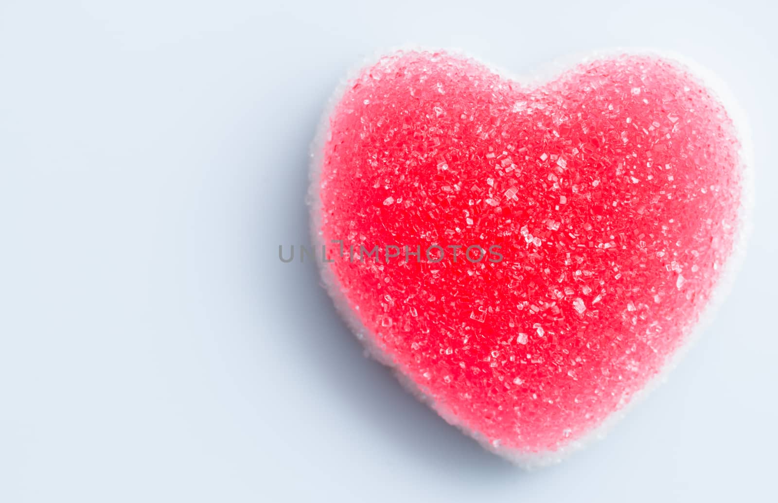 sugar heart shaped candy on white background