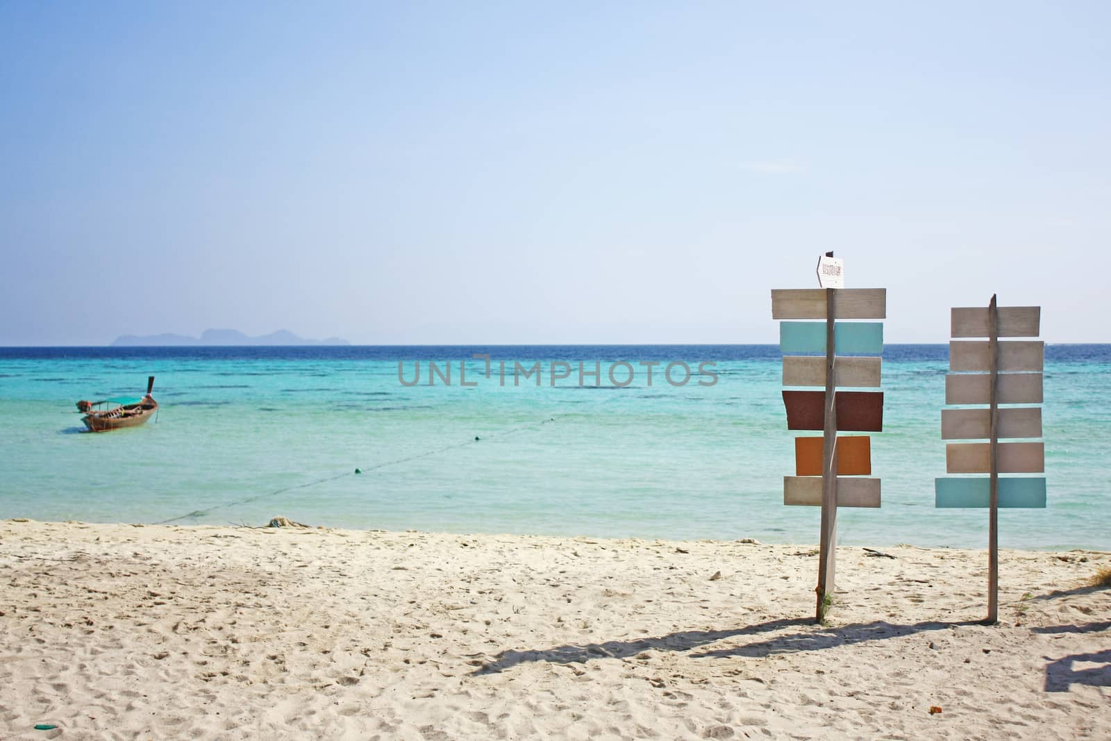 Sign on the beach in sunny day